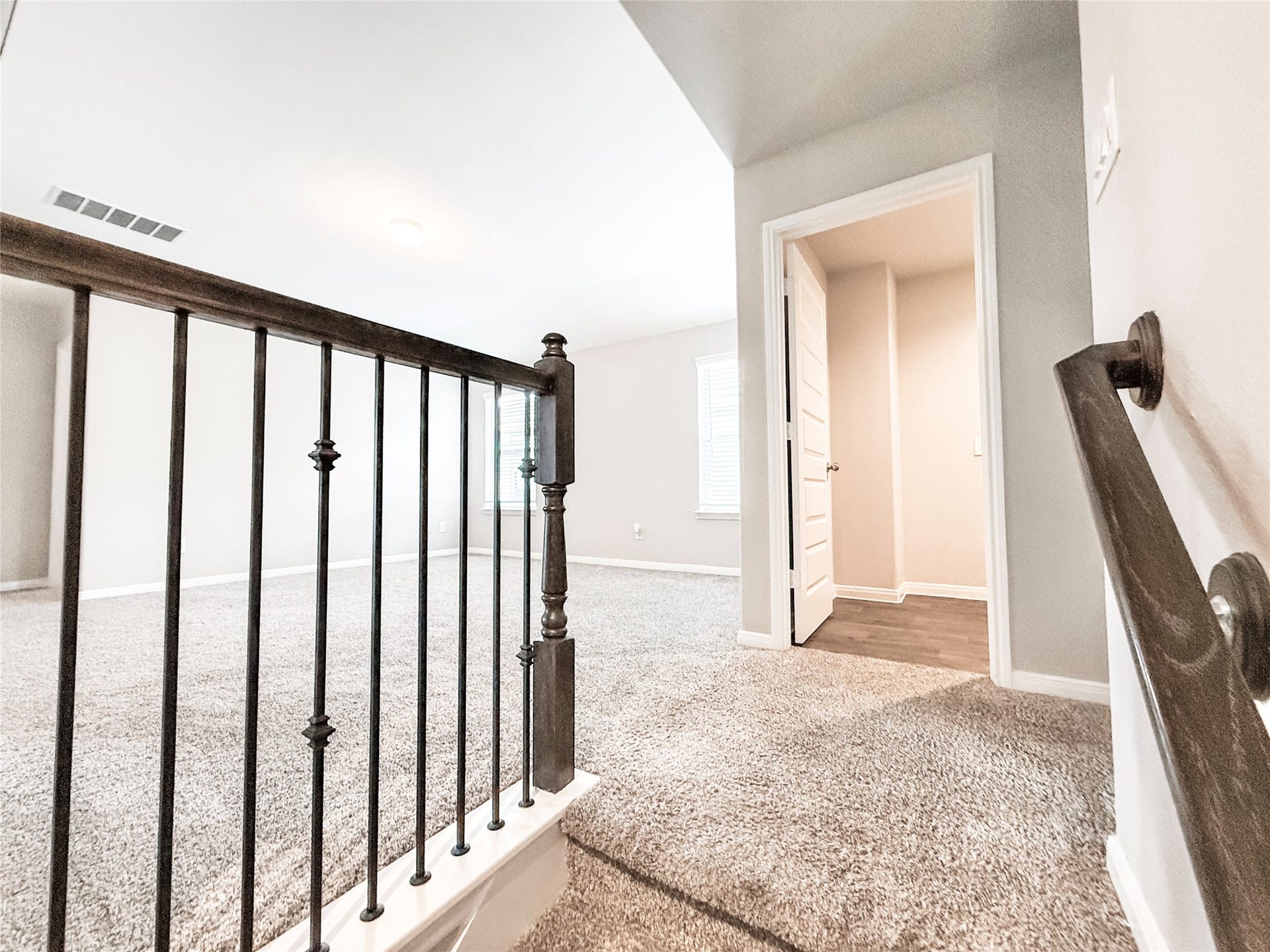 13009 Leisure Cove Drive, Texas City, TX 77568 Stairway opens to a spacious game room and additional living space. Across the hall is the conveniently located laundry area!