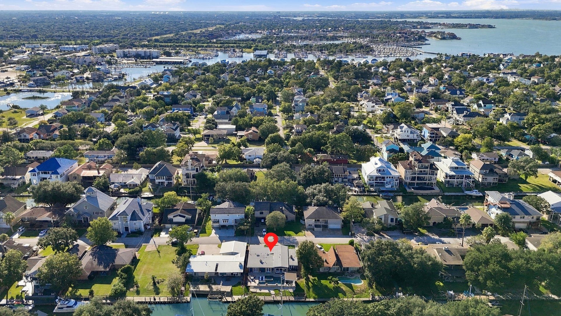 10 Harbor Lane, Kemah, TX 77565 Charming waterfront property nestled in a lush, vibrant neighborhood with easy access to scenic waterways and nearby amenities.
