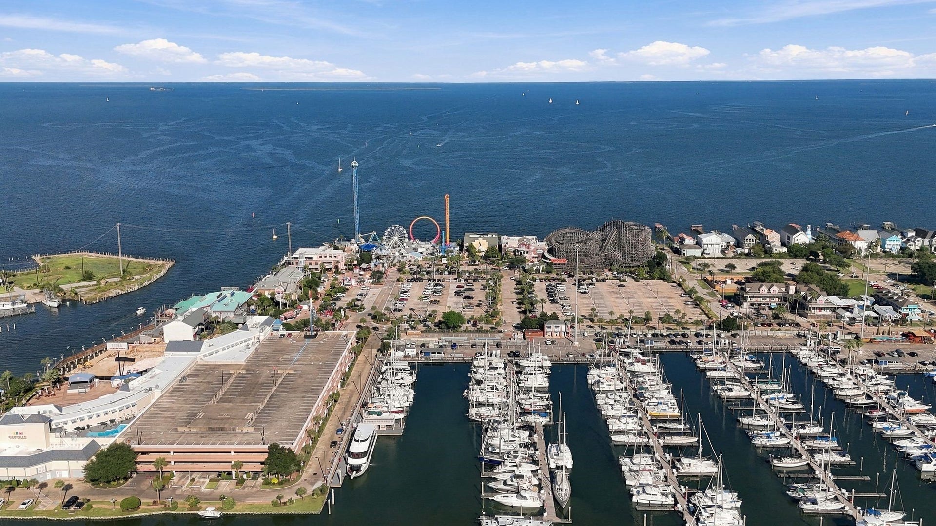 10 Harbor Lane, Kemah, TX 77565 Prime waterfront location with stunning marina views, adjacent to Kemah Boardwalk and vibrant community amenities.