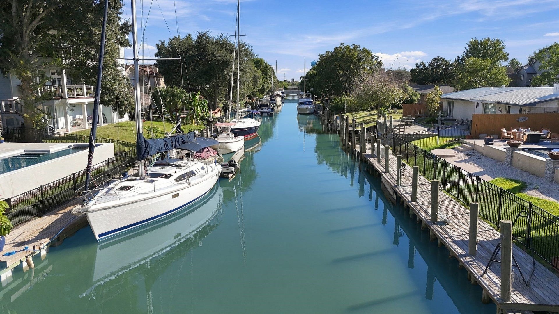 10 Harbor Lane, Kemah, TX 77565 Charming waterfront property with private boat dock access along a serene canal, leading to Clear Lake and the Bay.
