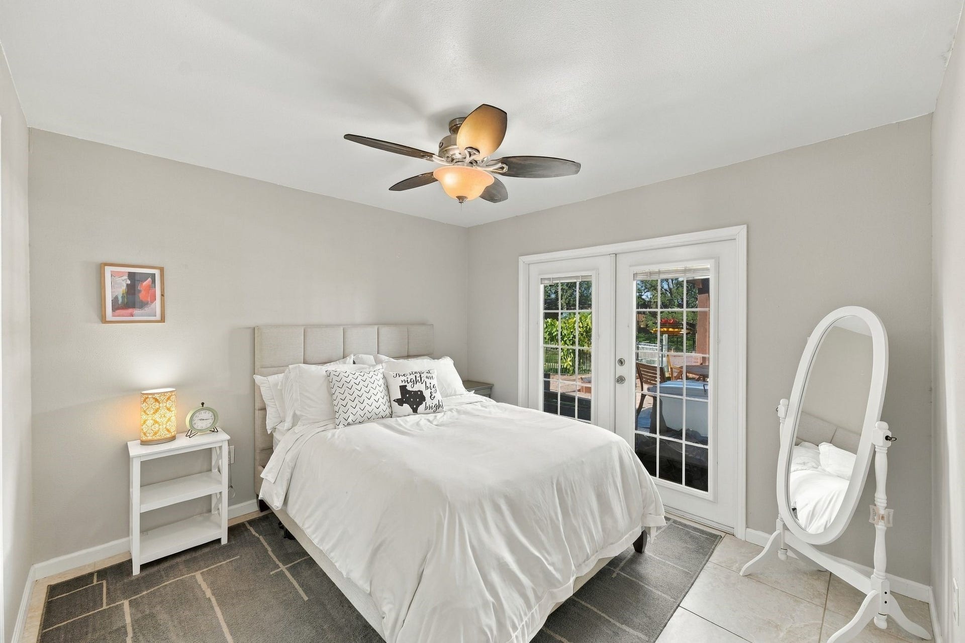 10 Harbor Lane, Kemah, TX 77565 The secondary bedroom is located on the first floor, shares a Jack N Jill bathroom, and has Cozy French doors leading the serene pool and waterfront.
