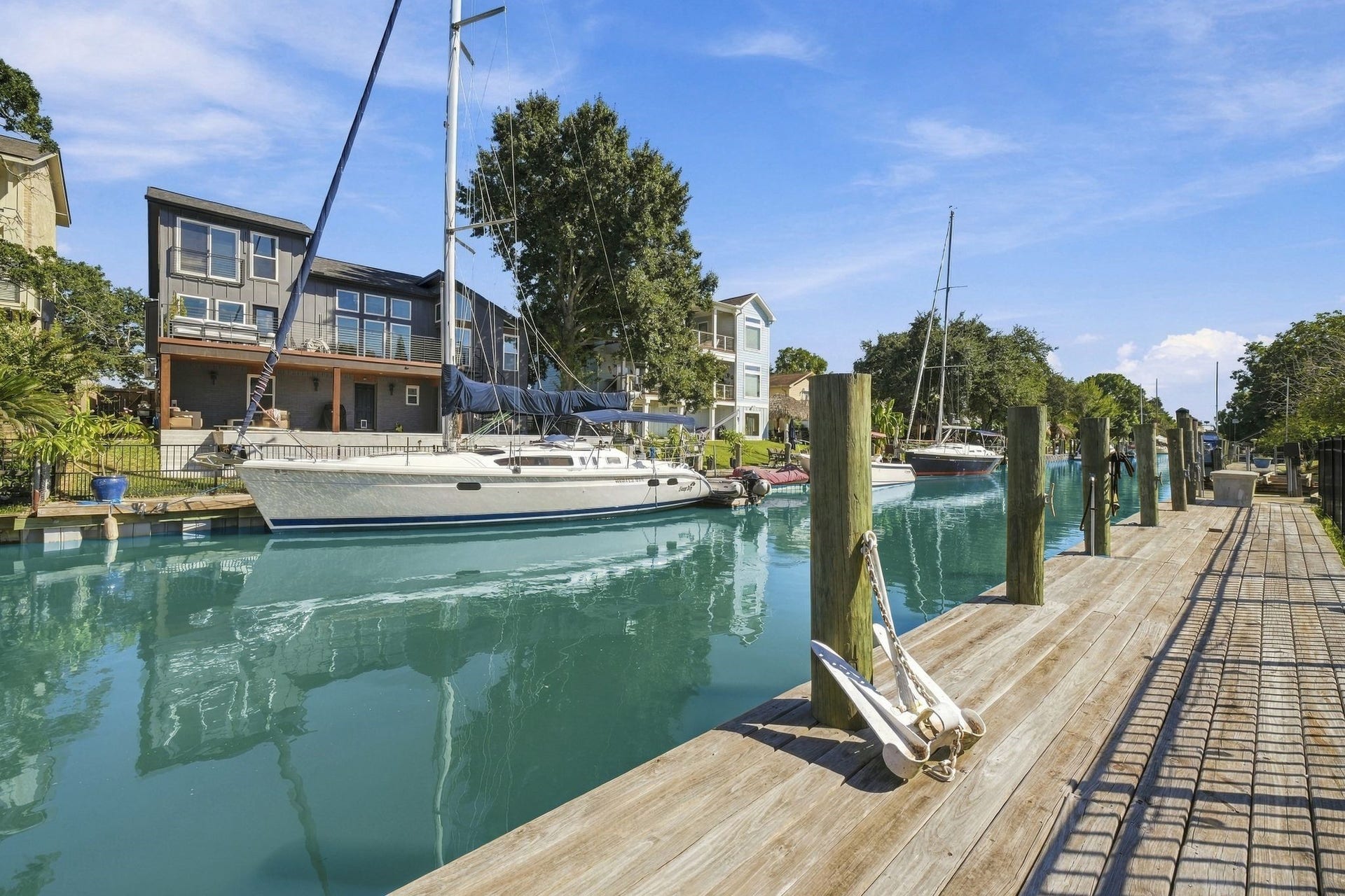 10 Harbor Lane, Kemah, TX 77565 Enjoy waterfront living with direct canal access and a private dock, perfect for boating enthusiasts.