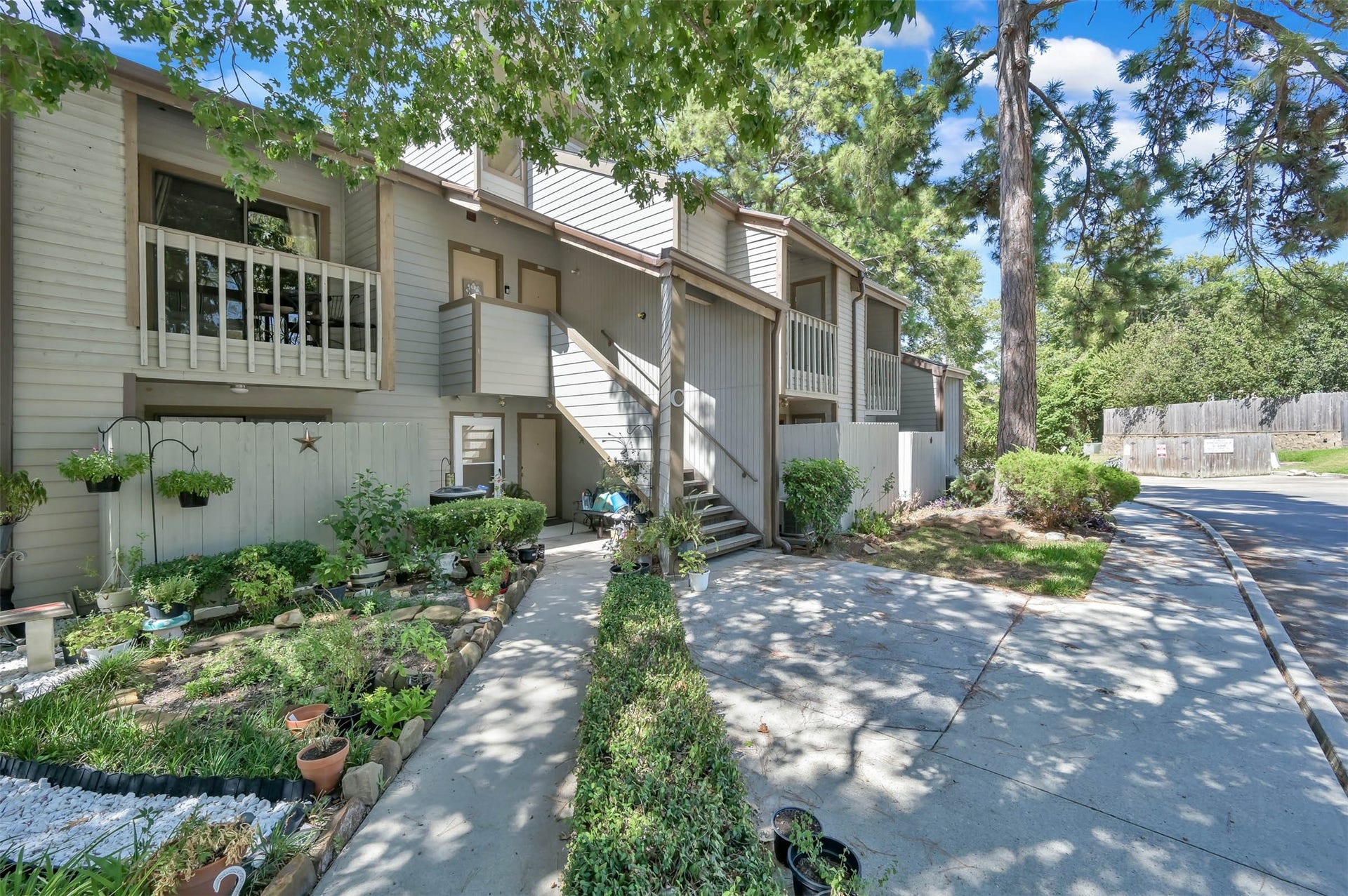 Exterior, up the stairs and unit is on the left