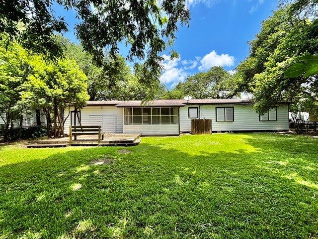 2419 Meadow Lane, La Marque, TX 77568 Backyard. Cute little sitting area. Could put a BBQ there or whatever you like!