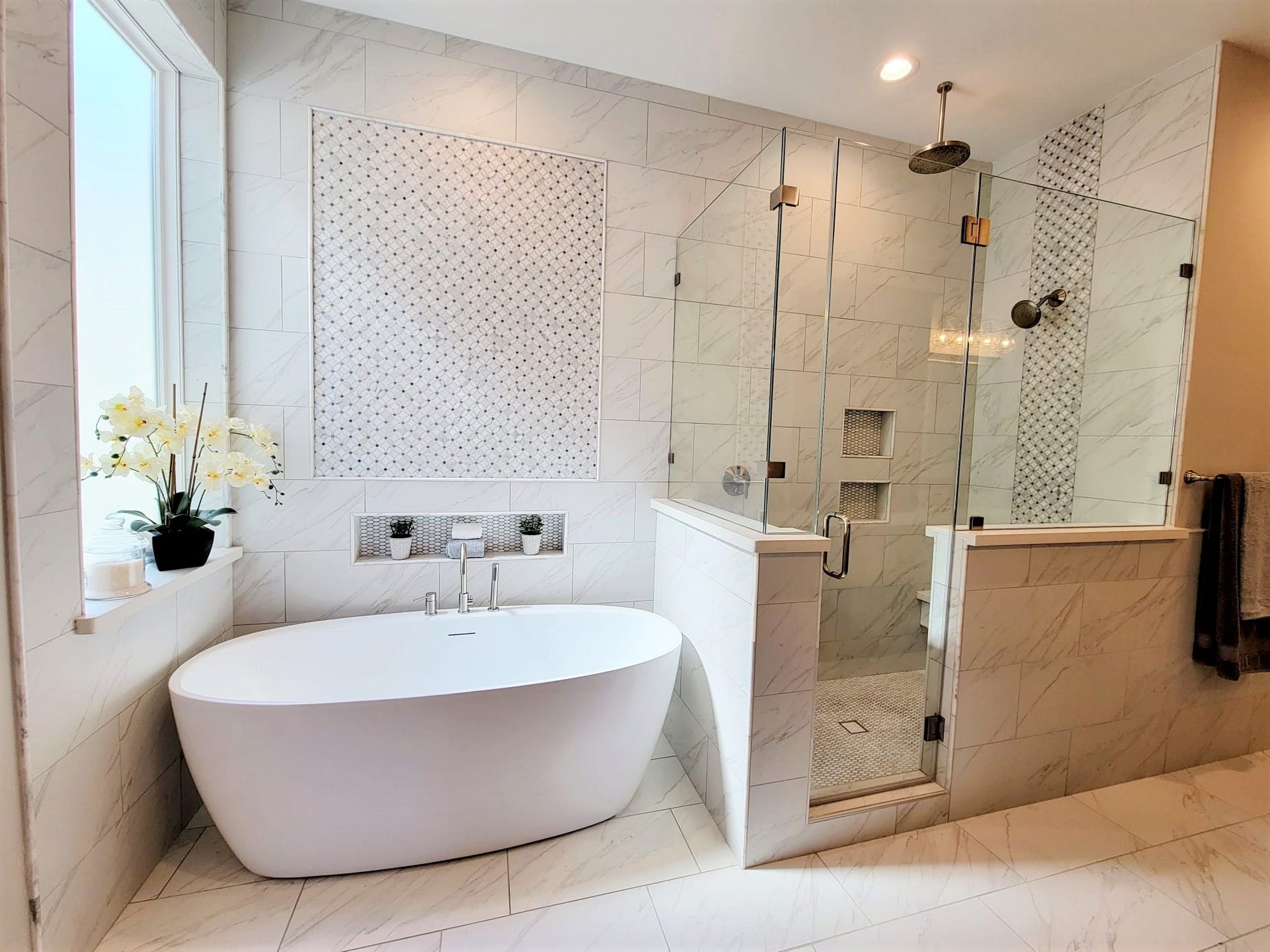 Luxurious stand alone tub with large walk-in shower. Enjoy the dual rain head shower.