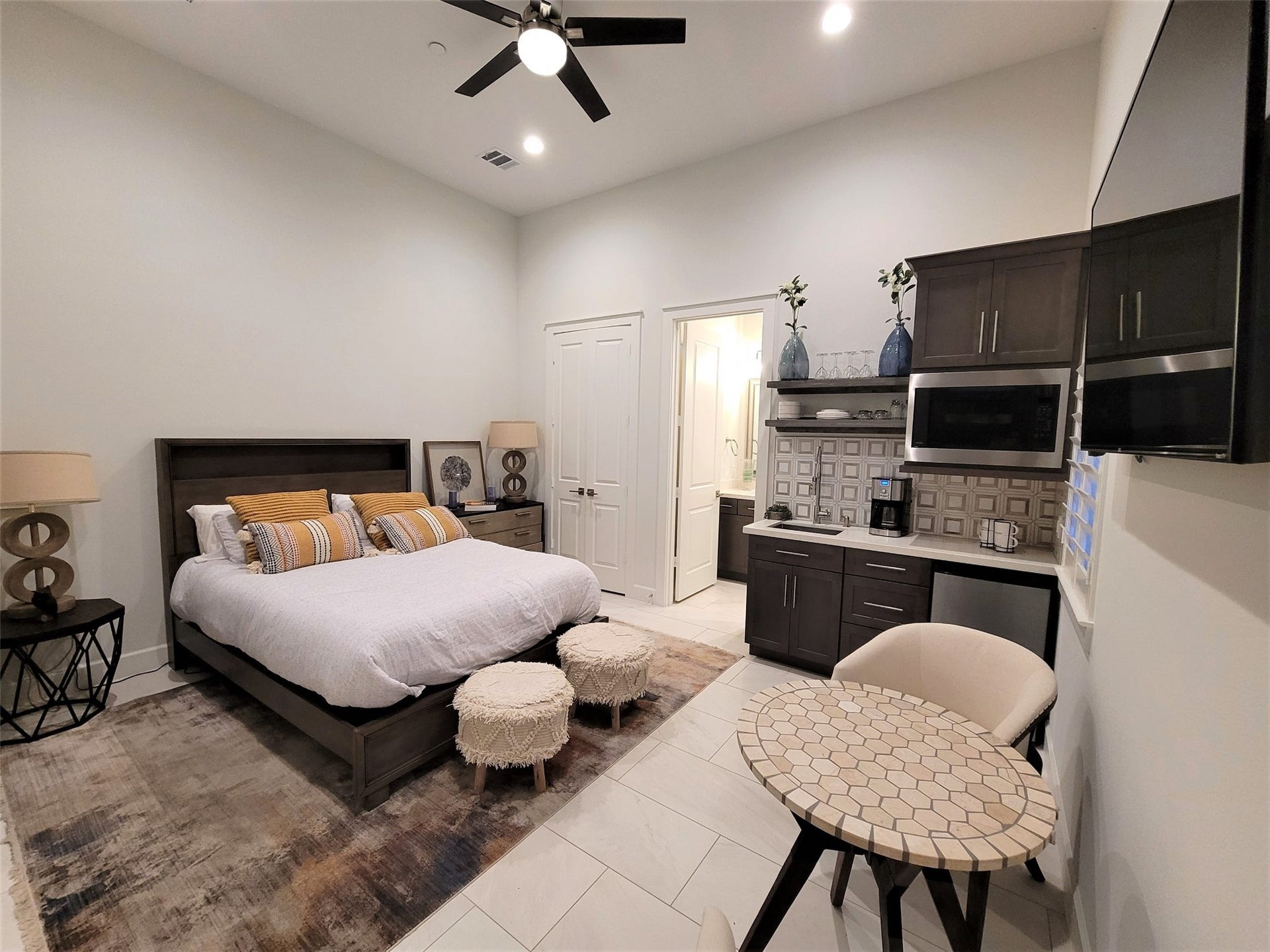 First floor bedroom with kitchenette, washer/dryer and a walk in shower.
