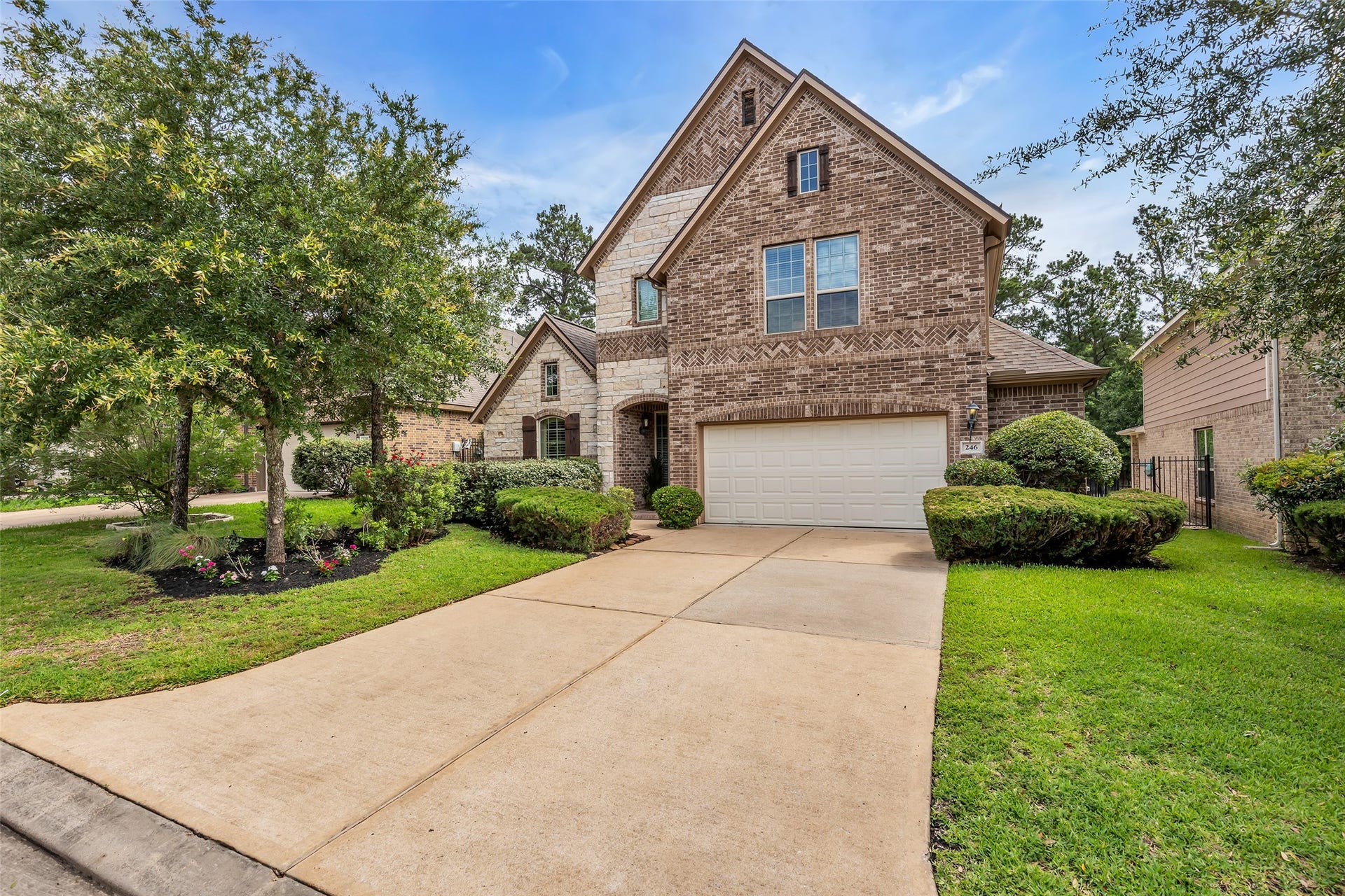 246 Hearthshire Circle, The Woodlands, TX 77354 Fresh landscaping and great curb appeal