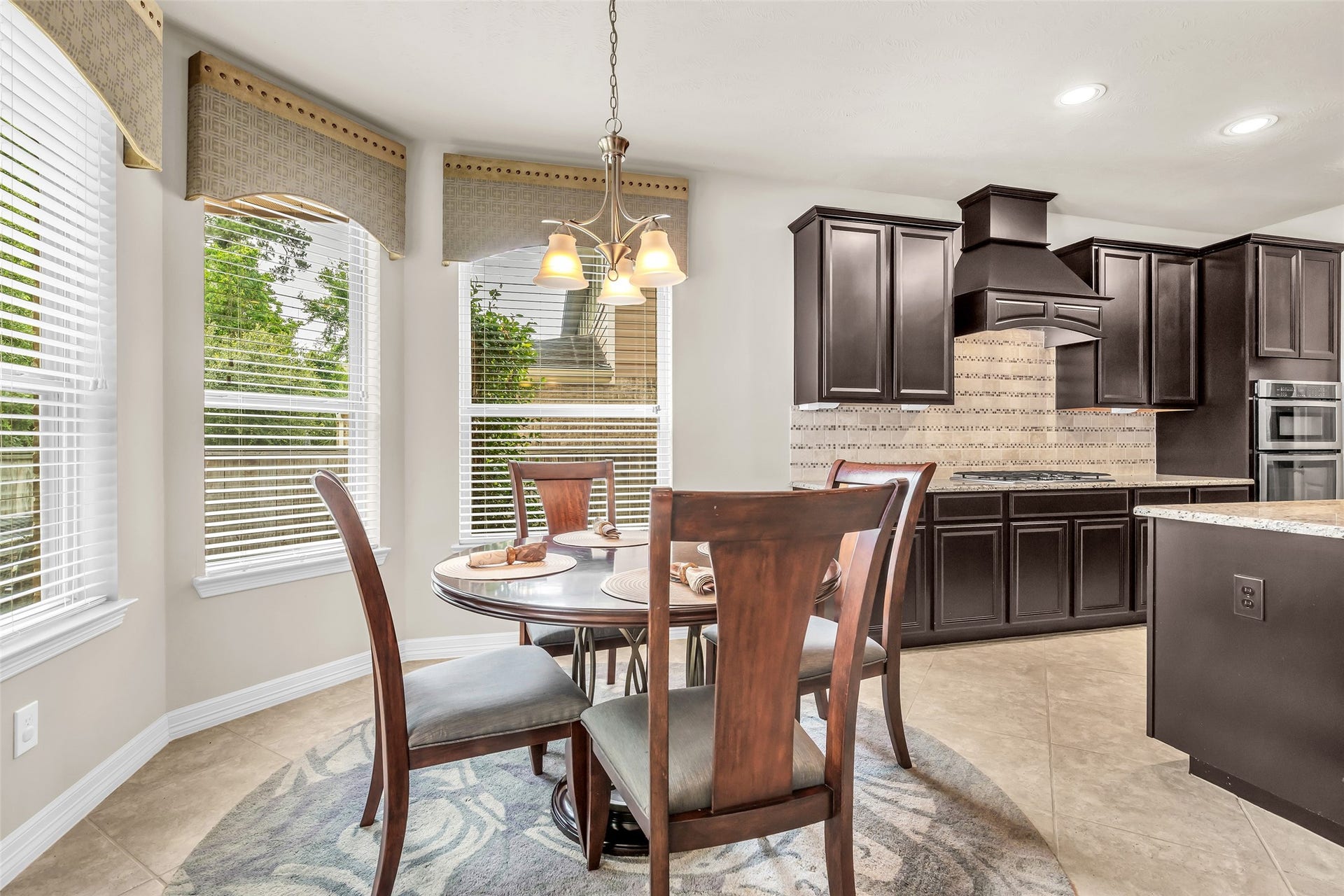 246 Hearthshire Circle, The Woodlands, TX 77354 Breakfast eating area with views of the pool/spa
