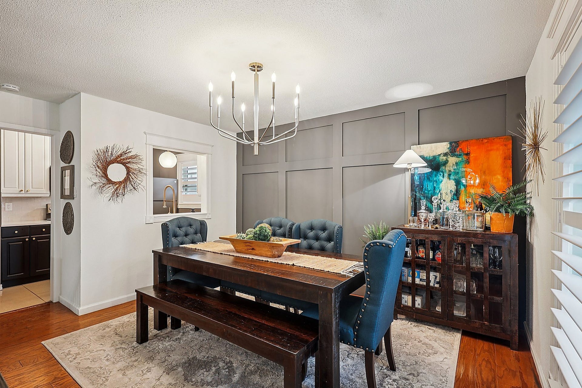 The dining area is a great focal point with that accent wall and pass through from the kitchen. Great place to entertain guests or enjoying a quiet dinner at home alone or with loved ones.