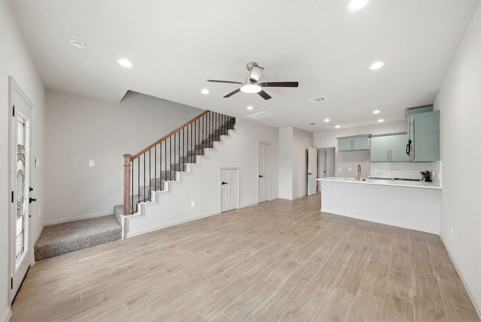 Spacious open concept living area connects seamlessly to the kitchen, creating a bright and functional layout with excellent flow.