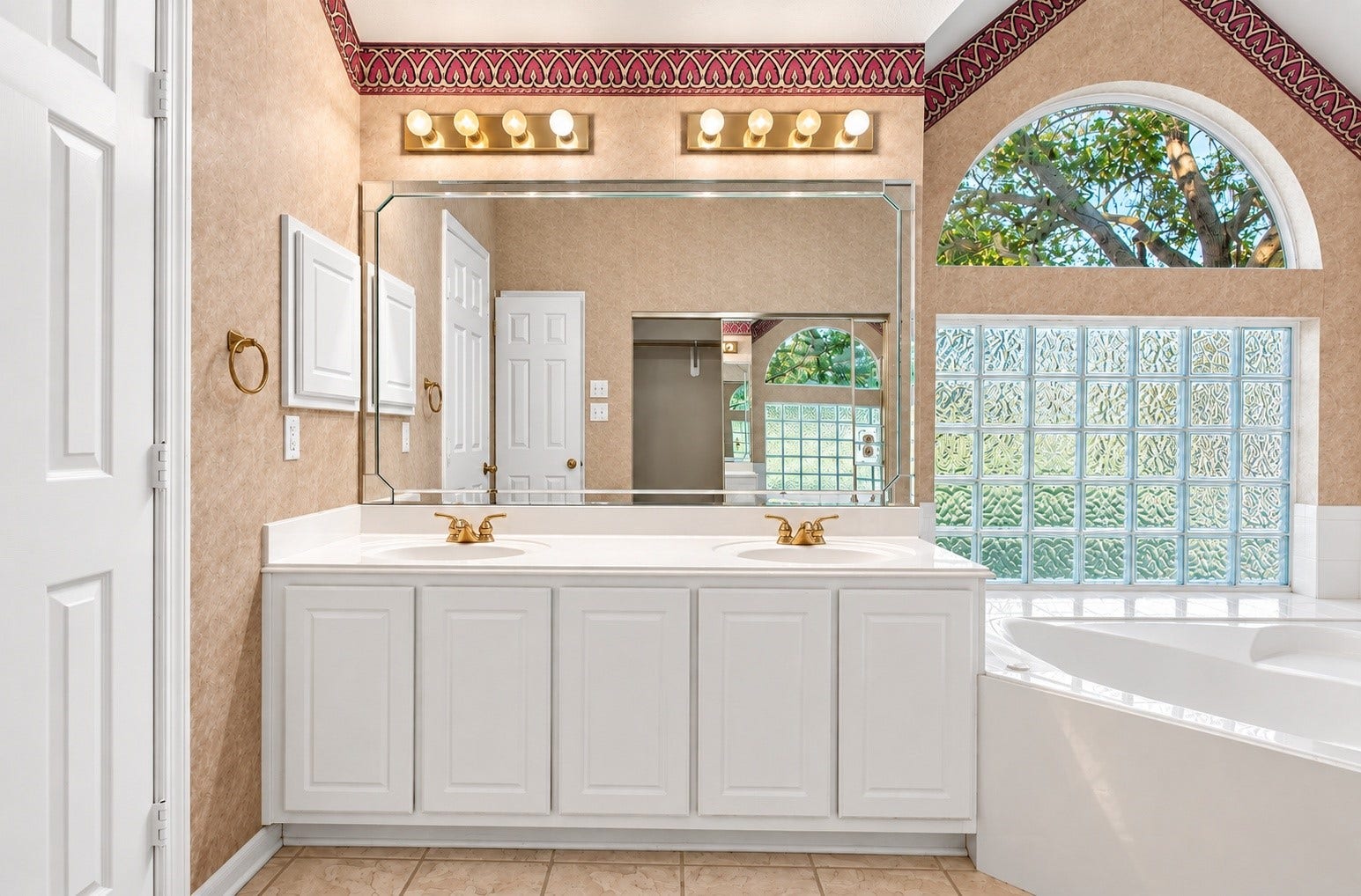 The primary bathroom has two sinks and a soaking tub!