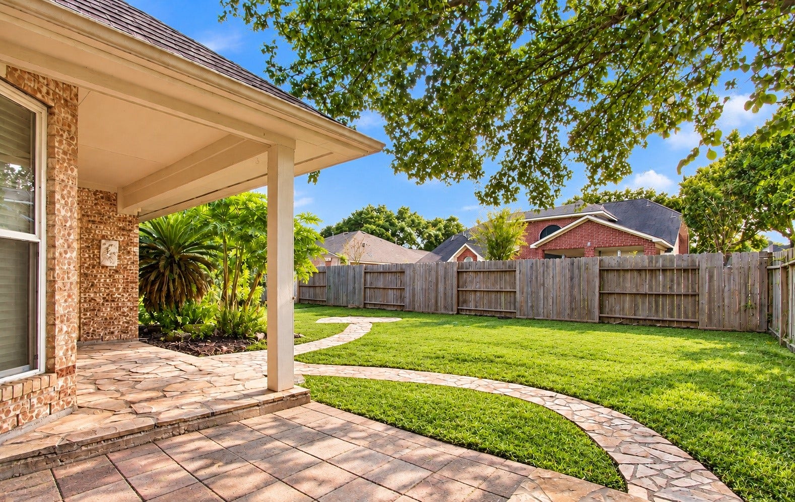 Spacious backyard with a covered patio!
