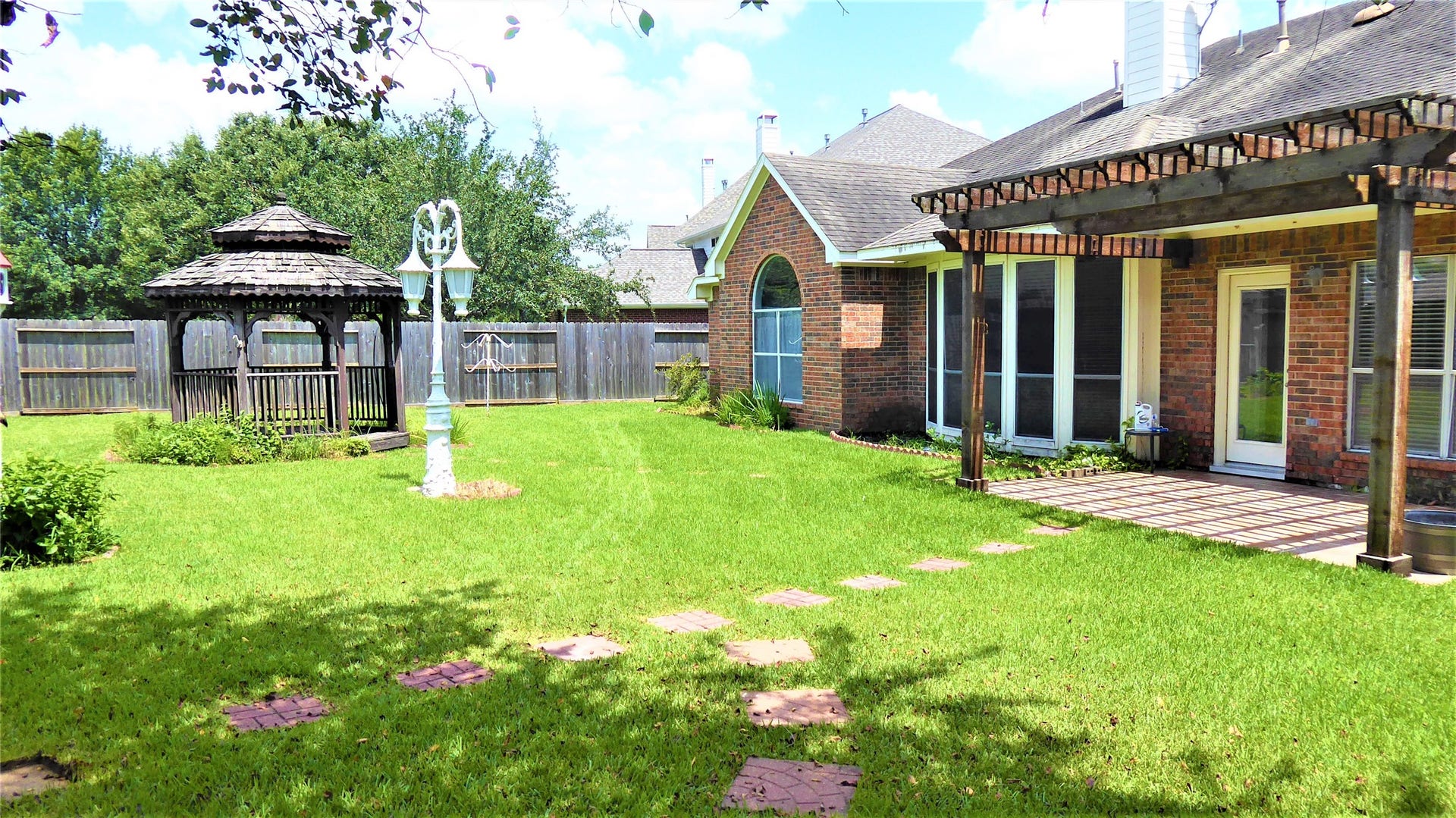 15915 Misty Heath Lane, Houston, TX 77084 view of the back yard. please note the gazebo was taken down due to its conditions
