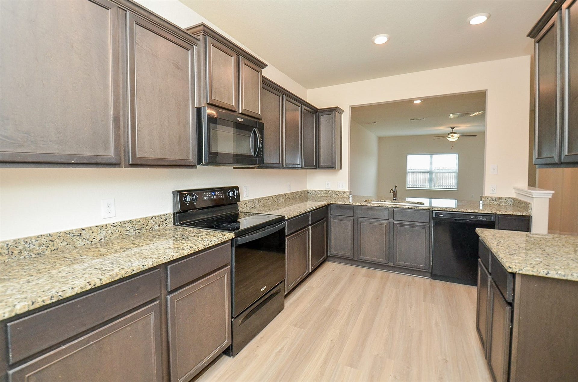 Granite counters and Luxury Vinyl Flooring.
