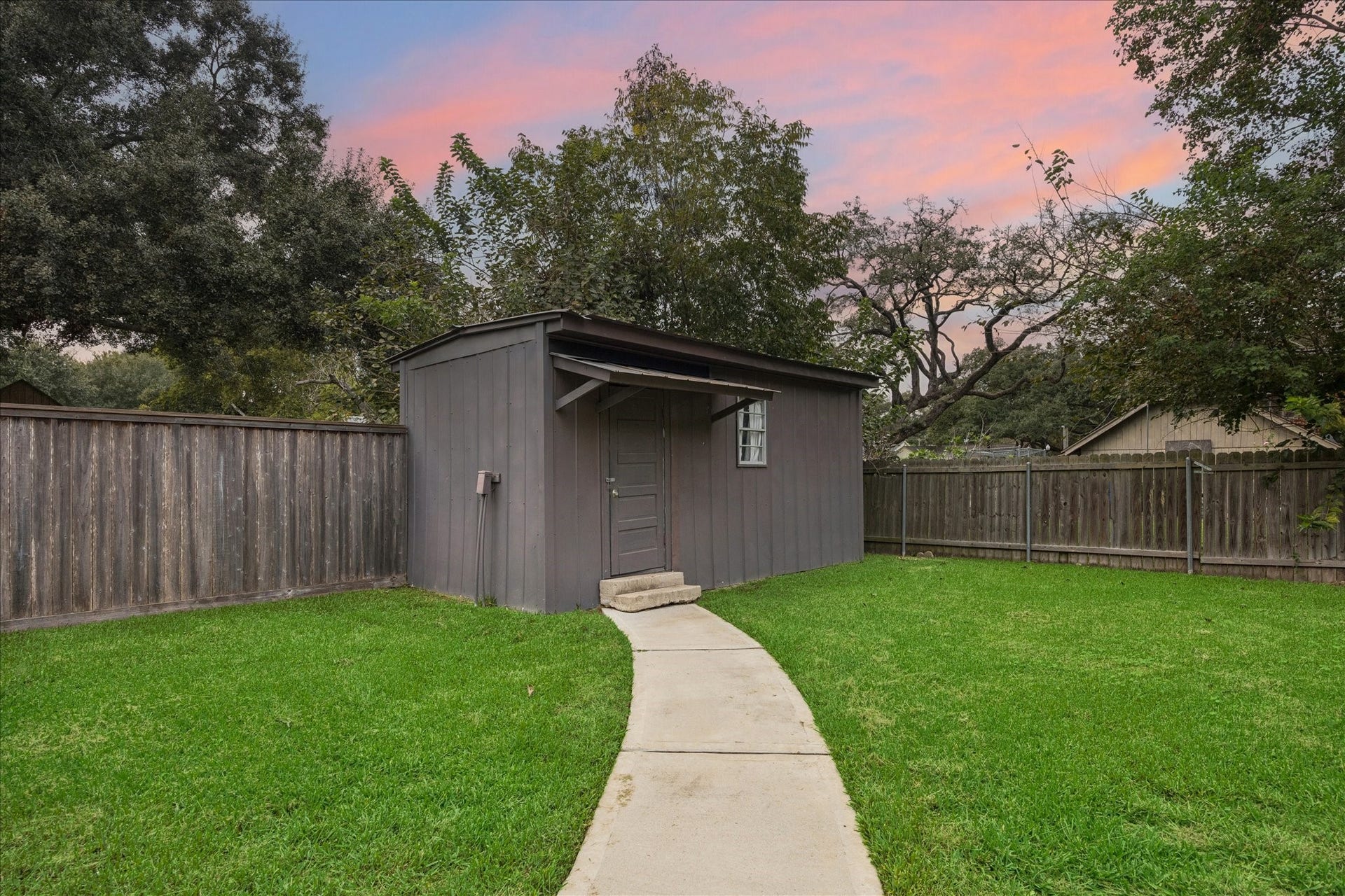 711 4th Street, Sealy, TX 77474 Spacious storage building in the back corner of the yard.