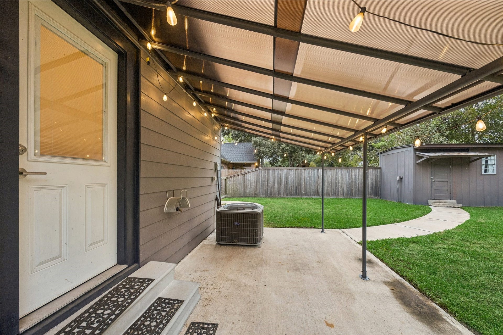 711 4th Street, Sealy, TX 77474 Covered back porch area that the backdoor leads to from the kitchen.