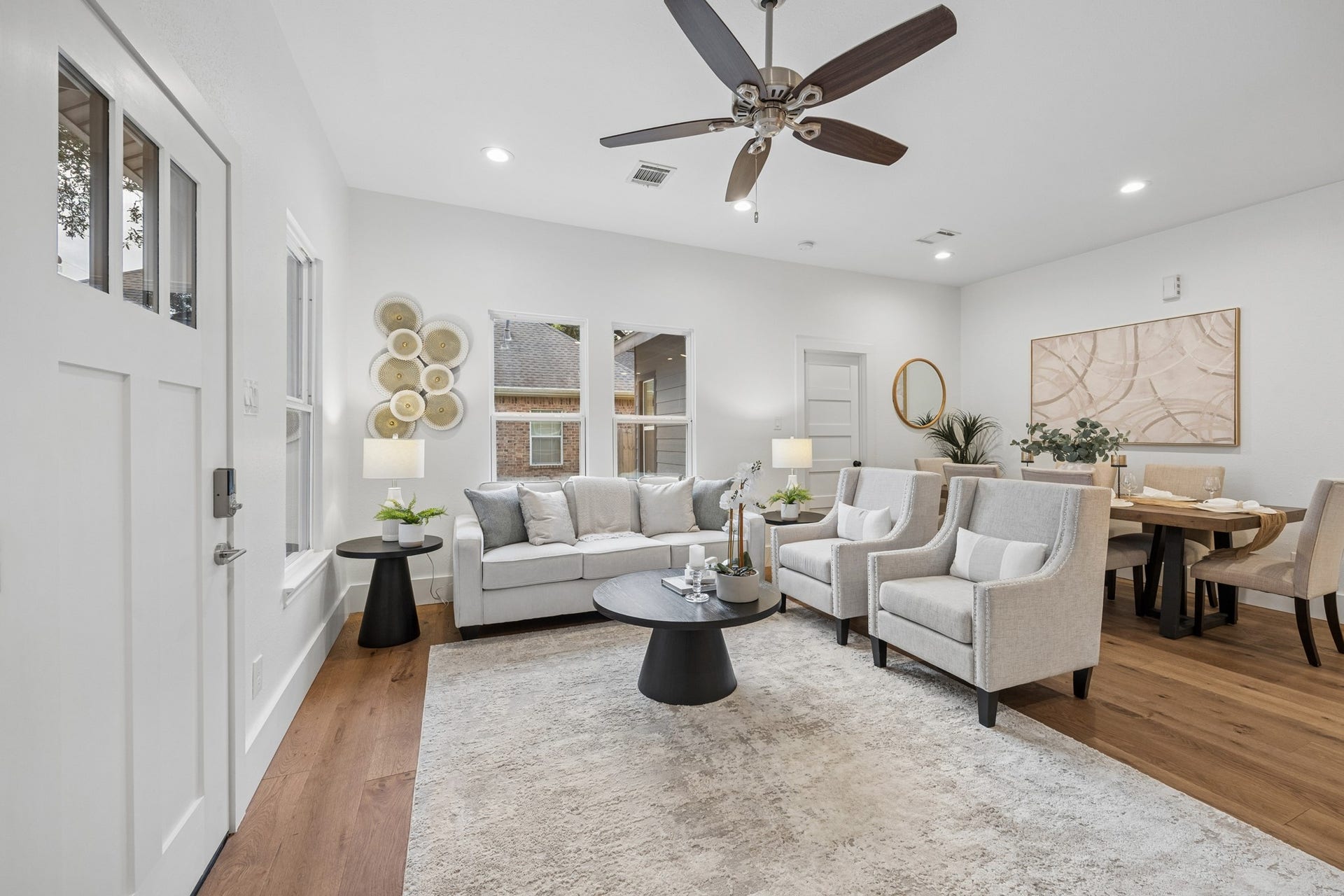 711 4th Street, Sealy, TX 77474 Bright and inviting living area seamlessly flowing into the dining space.