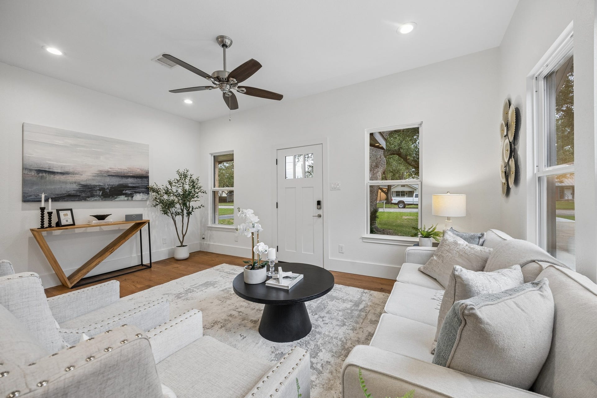 711 4th Street, Sealy, TX 77474 Living room featuring a neutral color palette and abundant natural light from large windows.