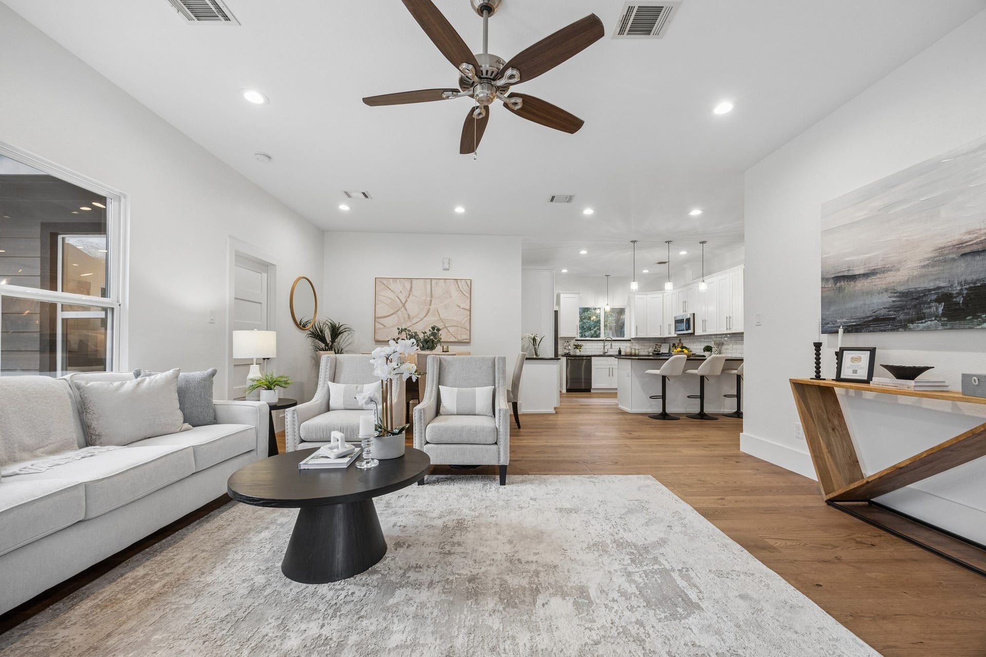 711 4th Street, Sealy, TX 77474 Open-concept living area and a stylish kitchen with a spacious island perfect for entertaining.