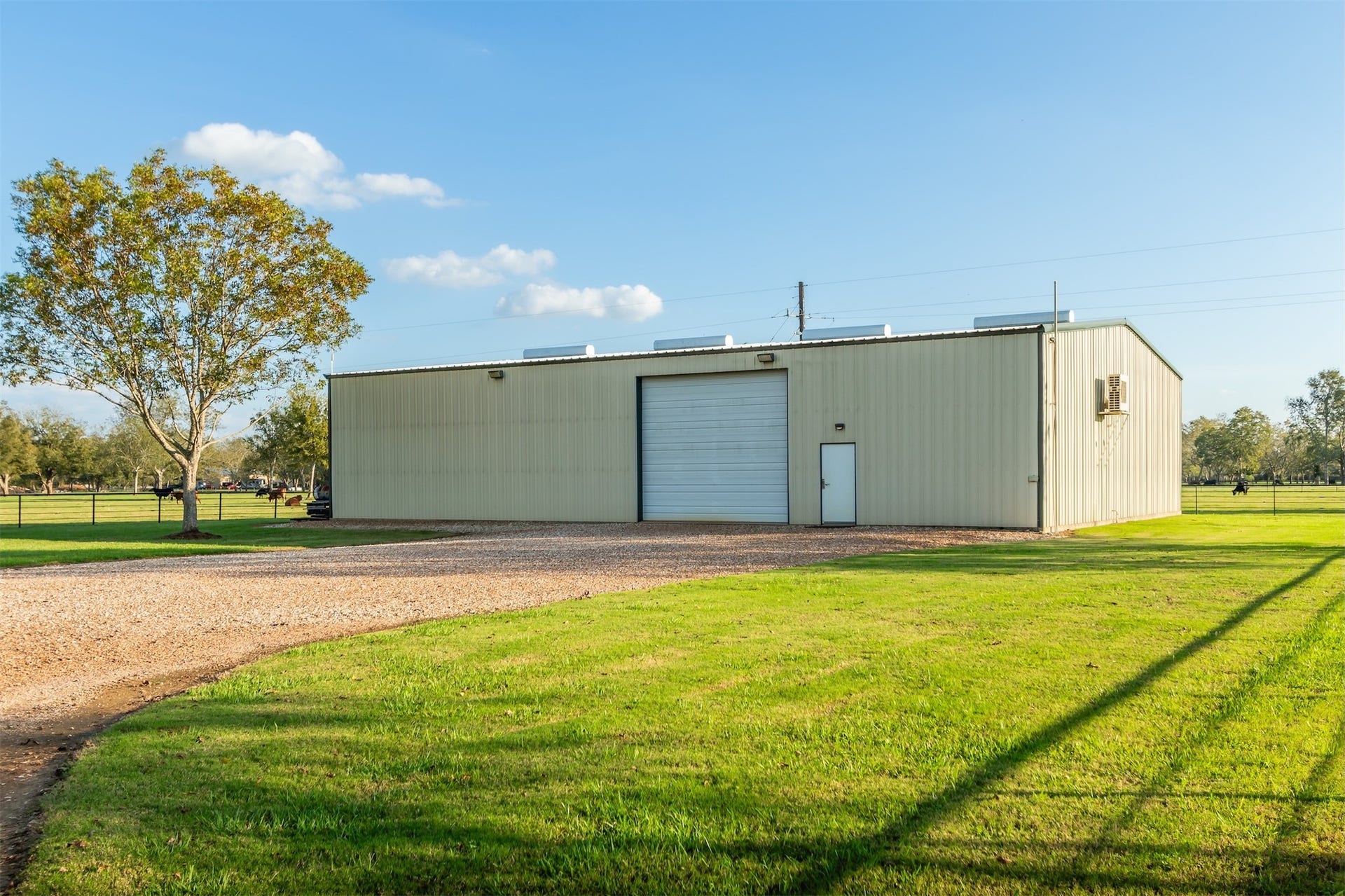 3150 Holmes Road Road, Richmond, TX 77406 Expansive 60x80 shop ideal for business, hobbies, or storage, set on a picturesque property.