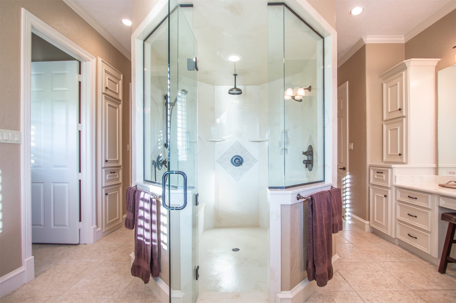 3150 Holmes Road Road, Richmond, TX 77406 Luxurious glass-enclosed shower offering a spa-like retreat with elegant fixtures and spacious design.