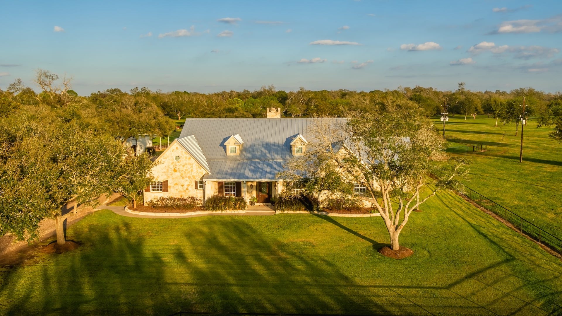 3150 Holmes Road Road, Richmond, TX 77406 Expansive countryside home nestled amid lush greenery, offering serene views and abundant space.
