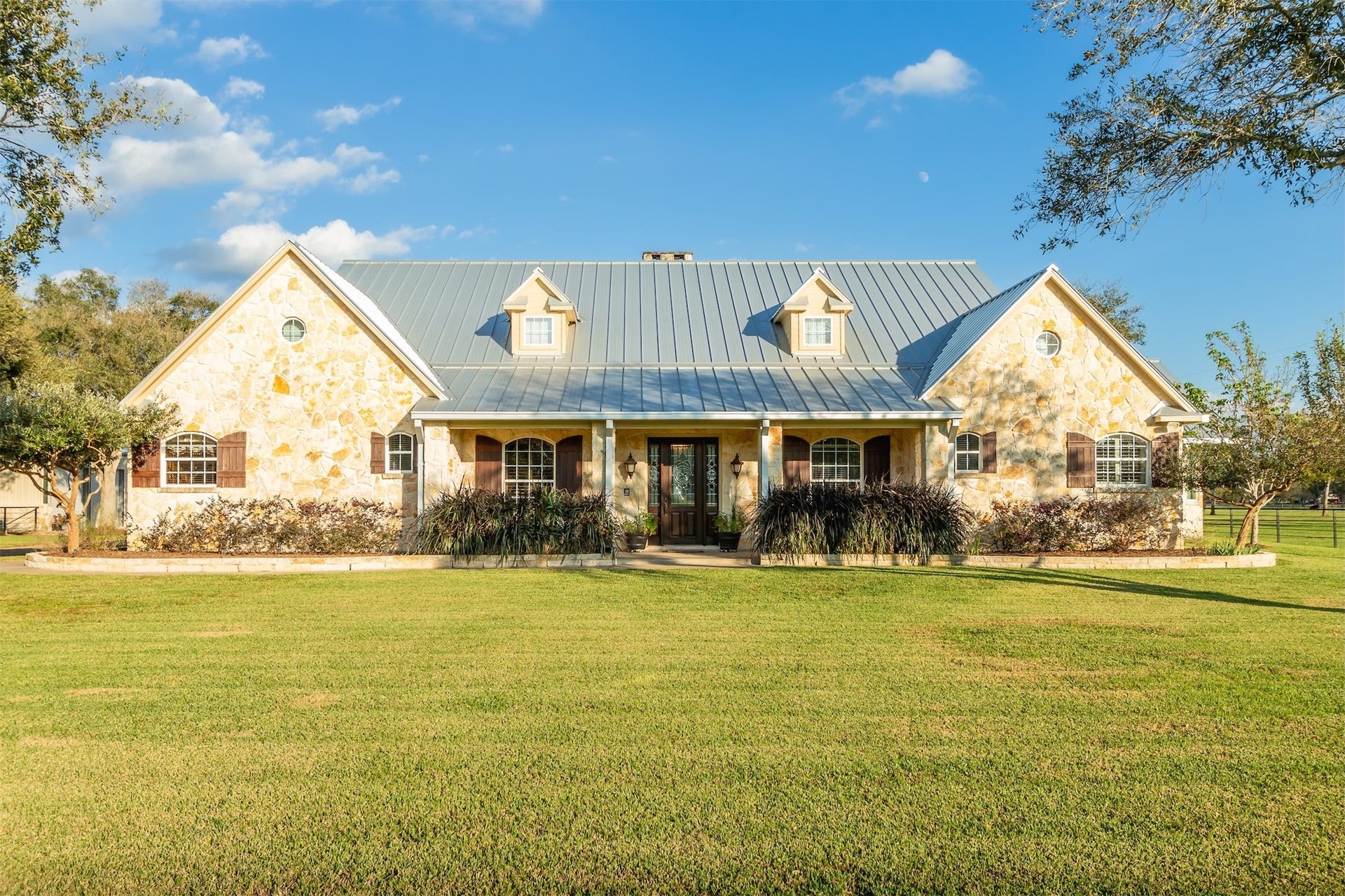 3150 Holmes Road Road, Richmond, TX 77406 Charming home with a durable Galvalume metal roof, blending style and longevity.