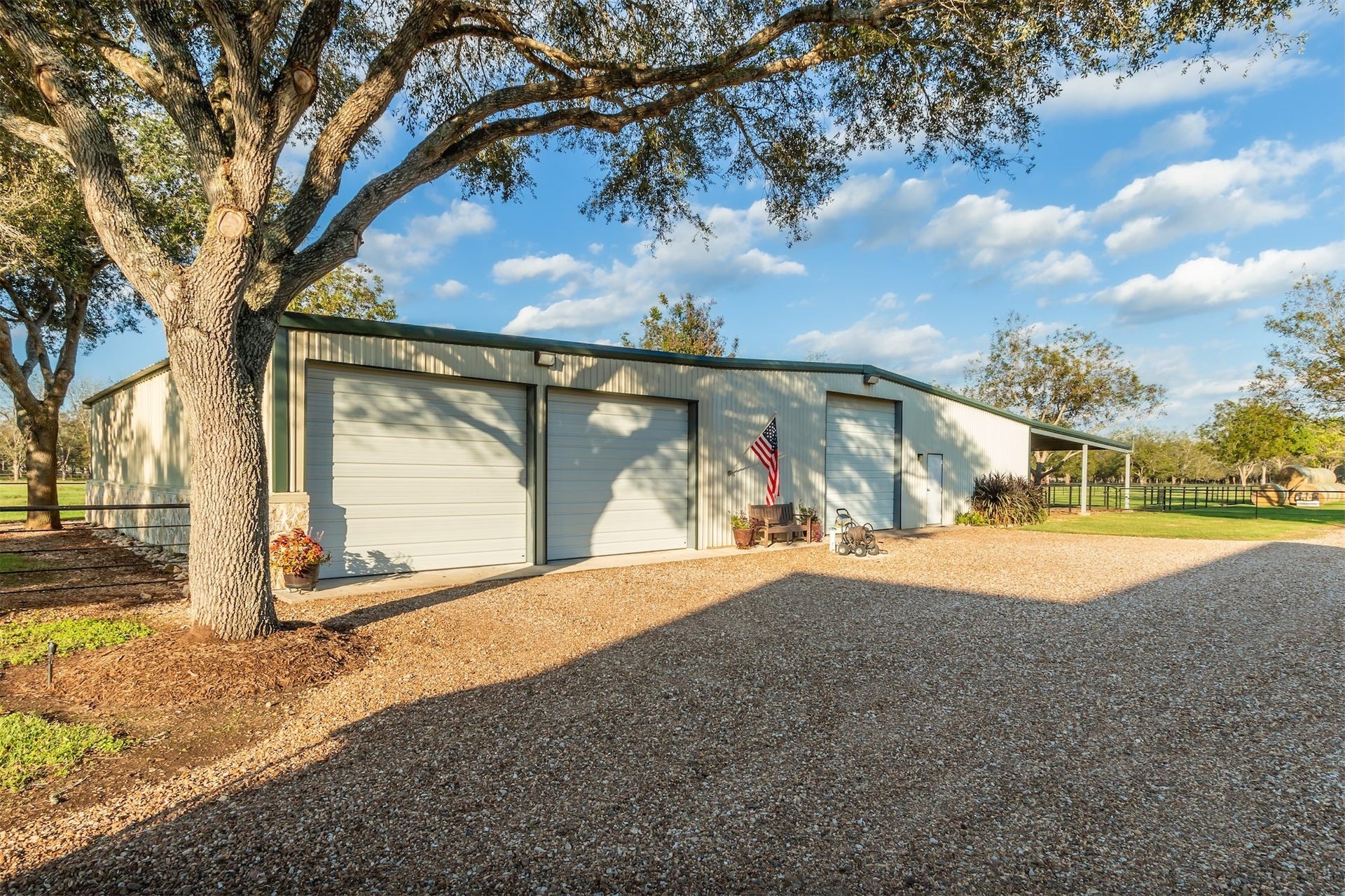 3150 Holmes Road Road, Richmond, TX 77406 Spacious barn featuring six roll-up doors and two convenient man doors, perfect for versatile use and easy access.