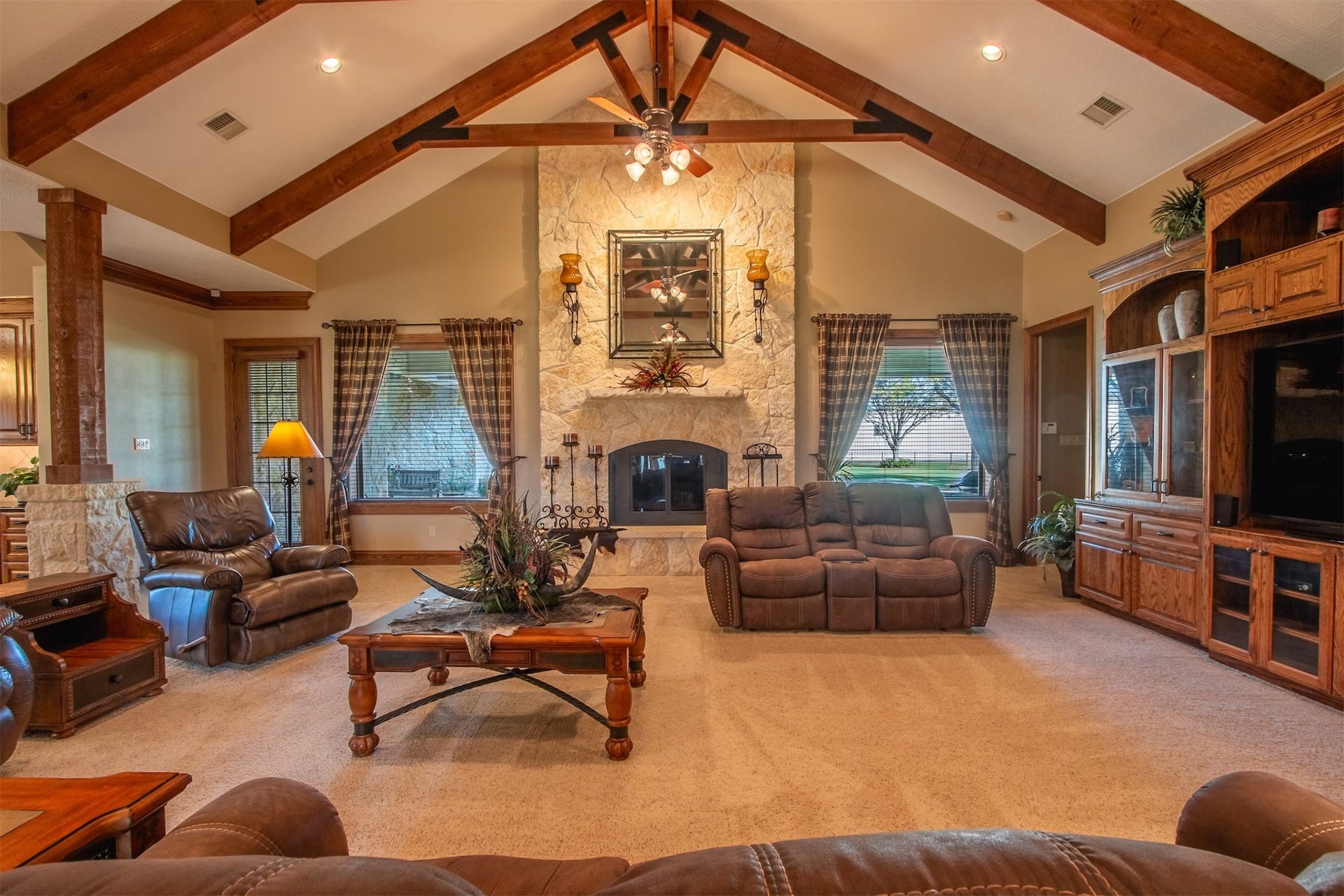 3150 Holmes Road Road, Richmond, TX 77406 Expansive living area with stunning vaulted ceiling and warm wood accents.
