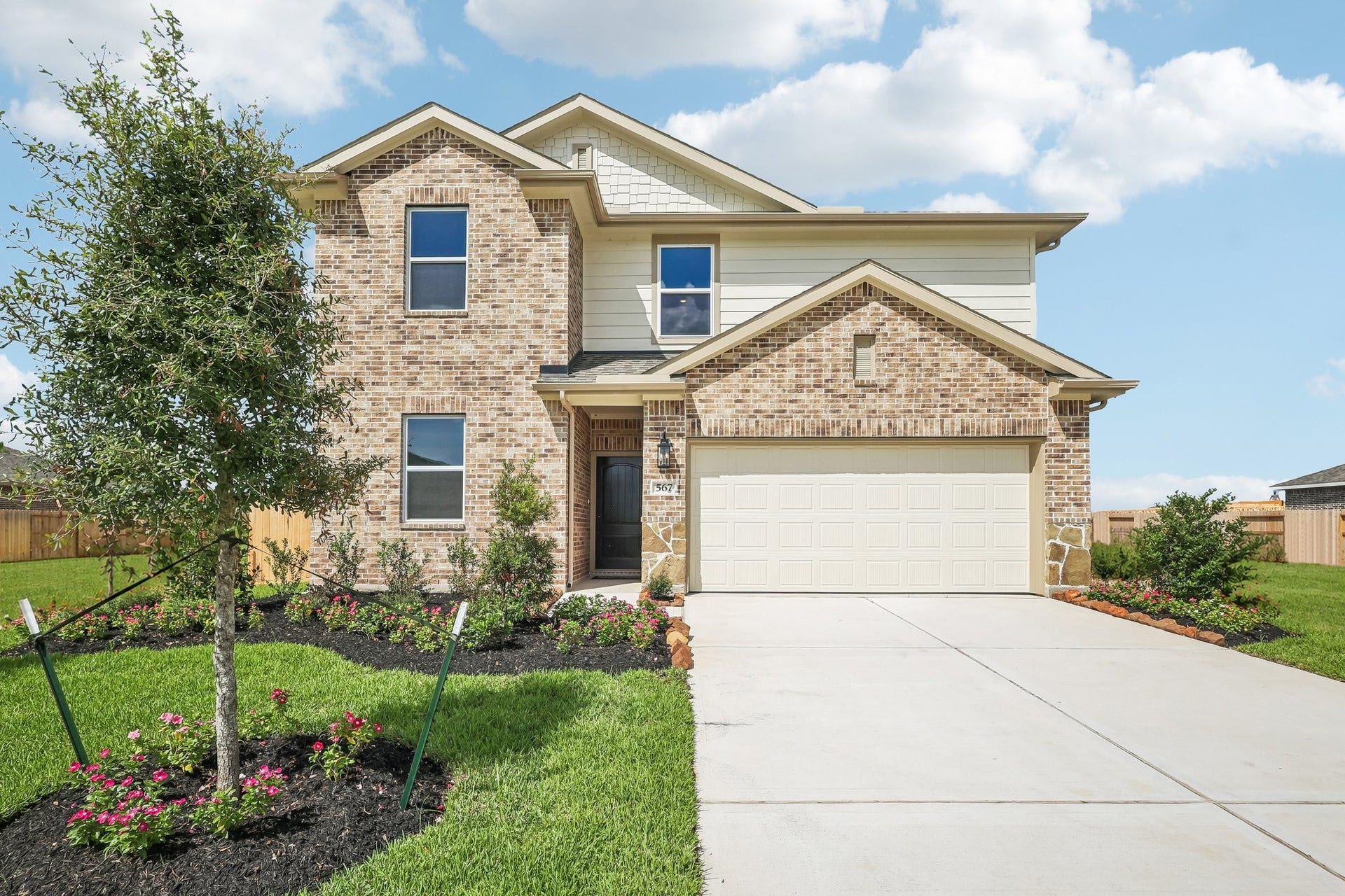 567 Day Station Drive, Dayton, TX 77535 Lovely Tigris II design by K. Hovnanian Homes in elevation SA built in Aspire at River Ranch Trails.