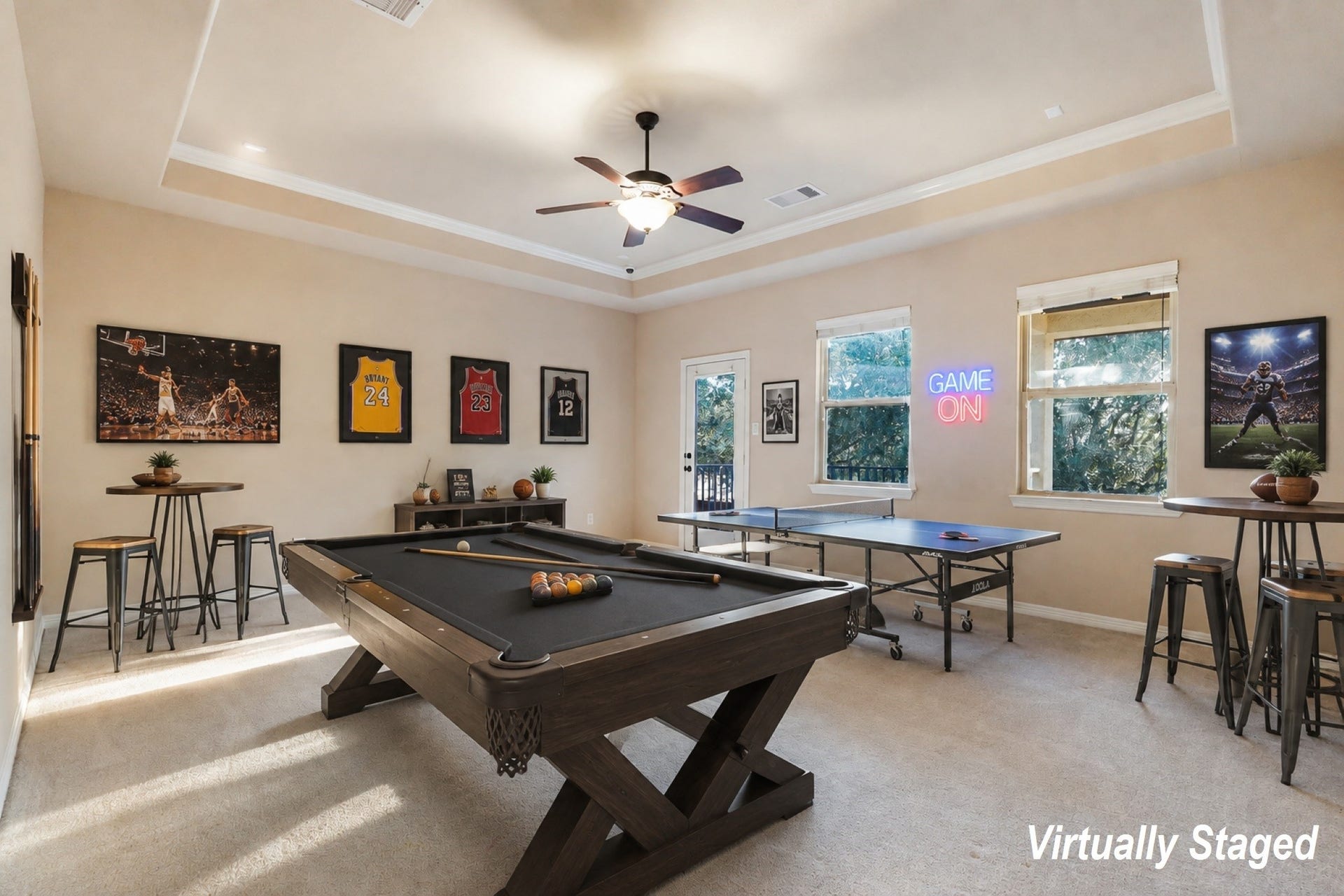 3102 Barrons Way, Sugar Land, TX 77479 *Virtually Staged* SECOND Flr-Game Room:This spacious, carpeted room features neutral walls, a ceiling fan, and a tray ceiling design. Natural light streams through two large windows and a glass door, which opens to a small balcony with tree views.