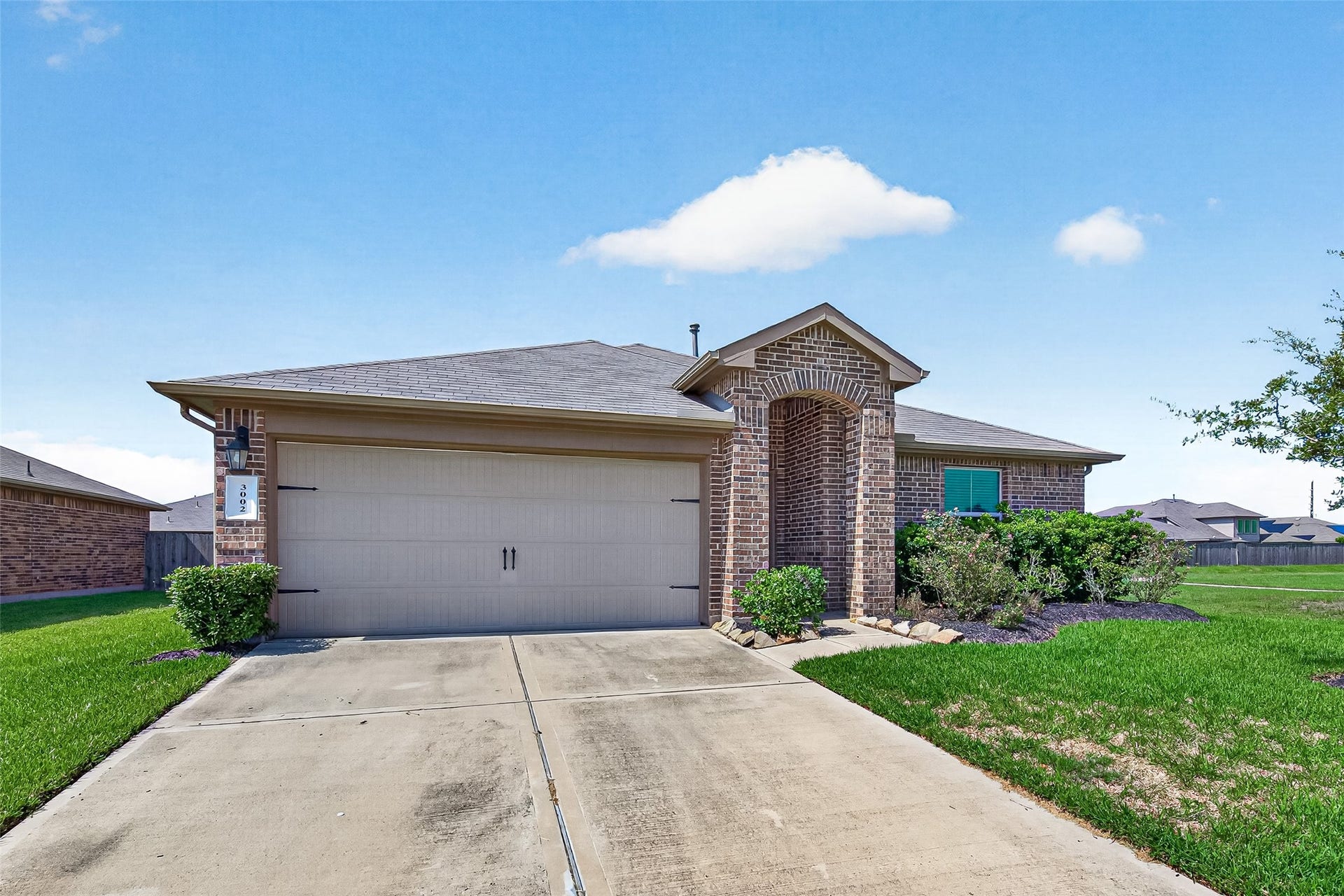 3002 Lightles Manor Court, Katy, TX 77494 Double wide driveway with two car garage.