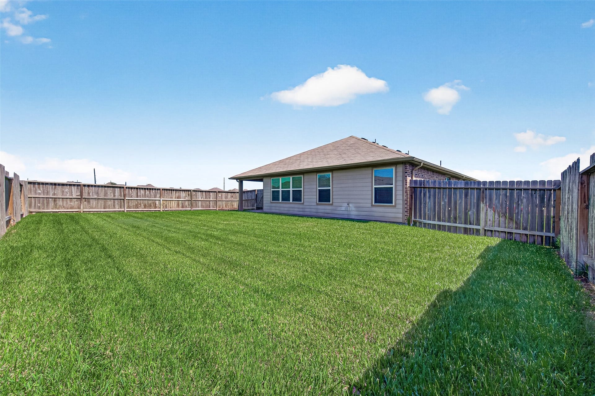 3002 Lightles Manor Court, Katy, TX 77494 Back yard is big enough for your children and pets to play.