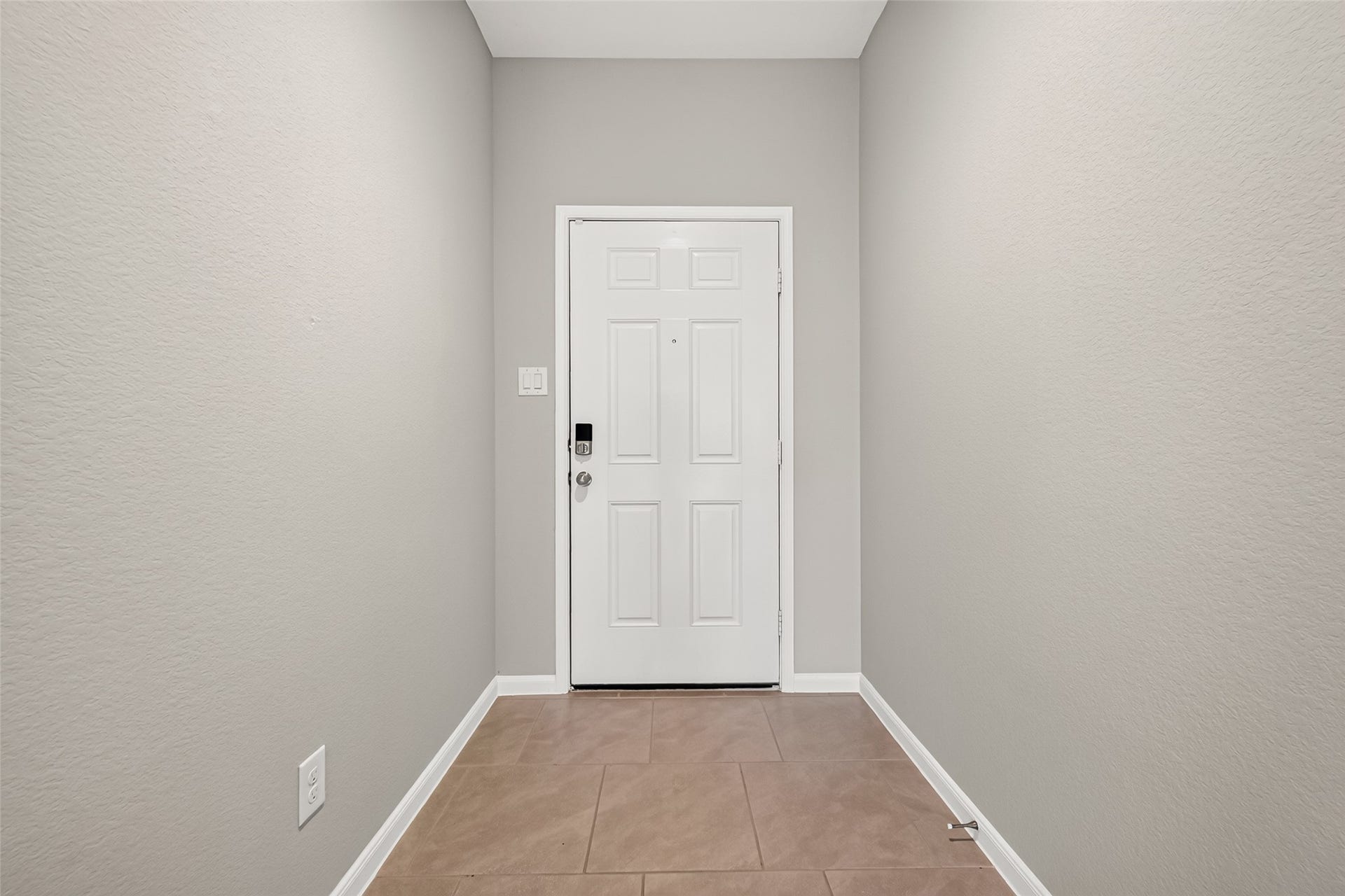 3002 Lightles Manor Court, Katy, TX 77494 Entrance of the house with tiles on the floor throughout the house.