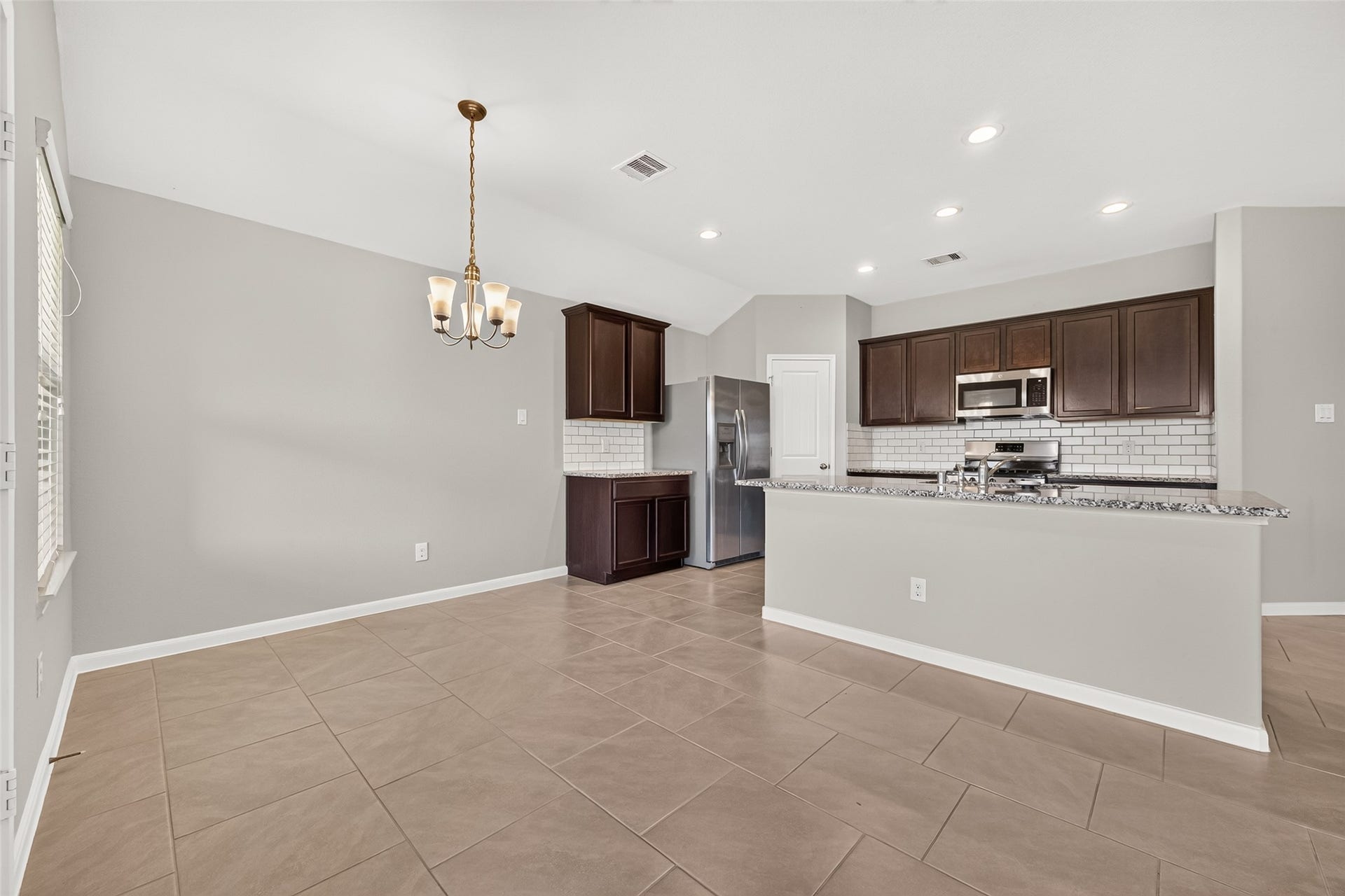 3002 Lightles Manor Court, Katy, TX 77494 Another view of the kitchen from the living area.