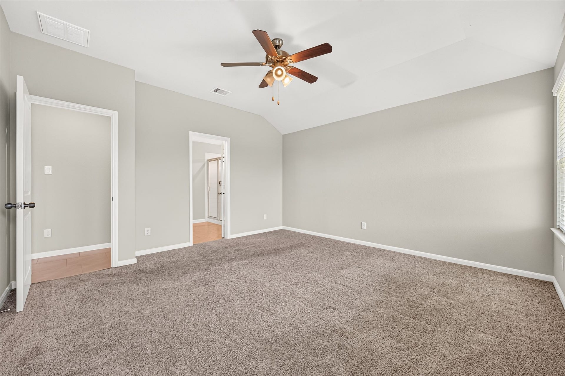 3002 Lightles Manor Court, Katy, TX 77494 Carpet throughout the master bedroom. Master bedroom is big enough for a king size bed.