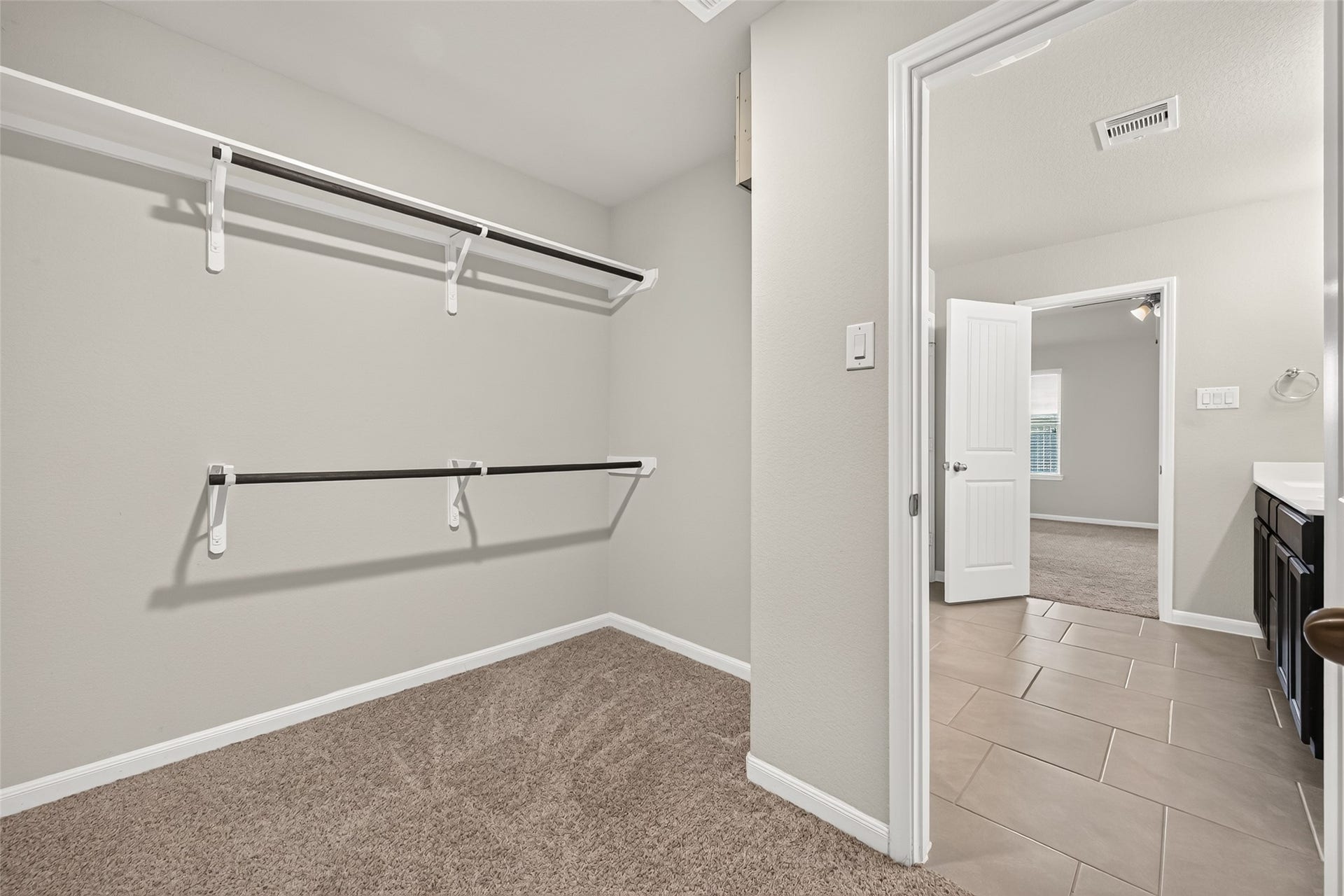 3002 Lightles Manor Court, Katy, TX 77494 Master bedroom closet haa carpet.