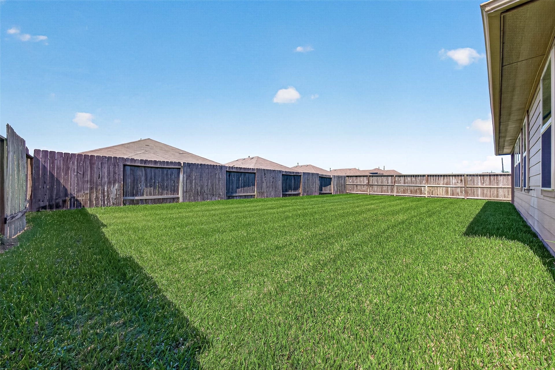 3002 Lightles Manor Court, Katy, TX 77494 Back yard is big enough to entertain friends and family.