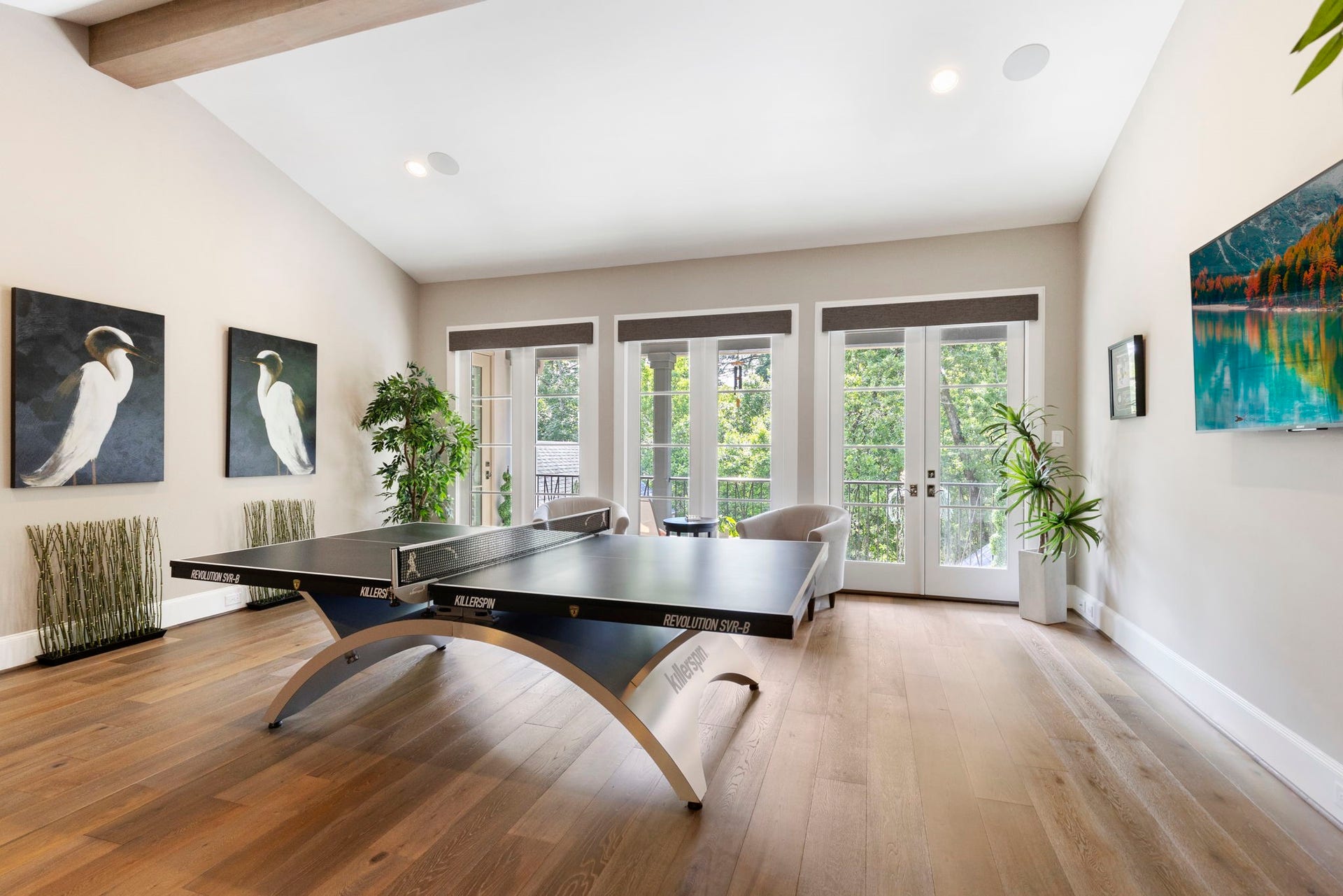 79 Simon Lake Lane, The Woodlands, TX 77381 Spacious game room with abundant natural light and French doors leading to a private balcony.
