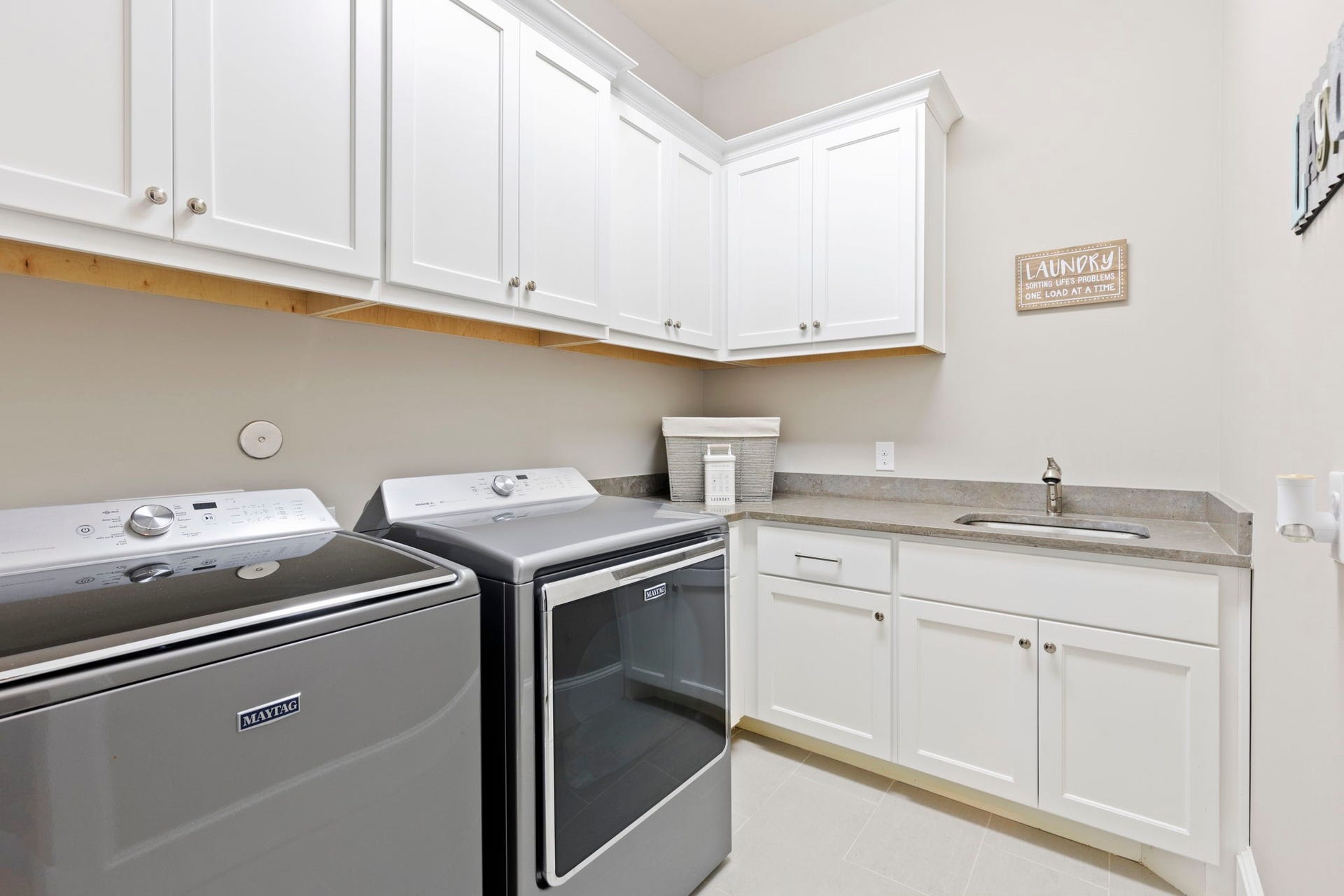 79 Simon Lake Lane, The Woodlands, TX 77381 Large utility room with extensive cabinetry and workspace.