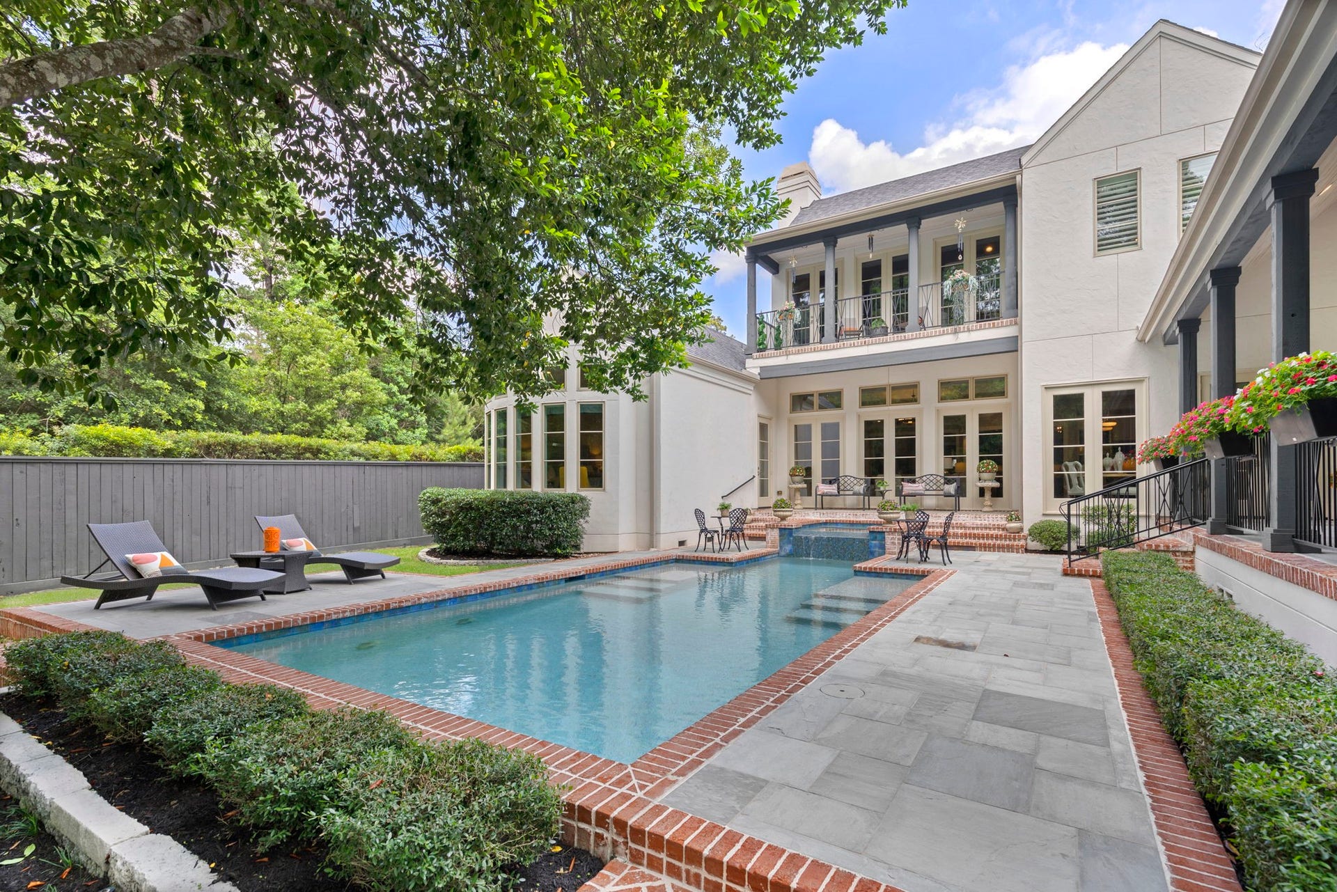 79 Simon Lake Lane, The Woodlands, TX 77381 Resort-style pool surrounded by lush landscaping and complete privacy.