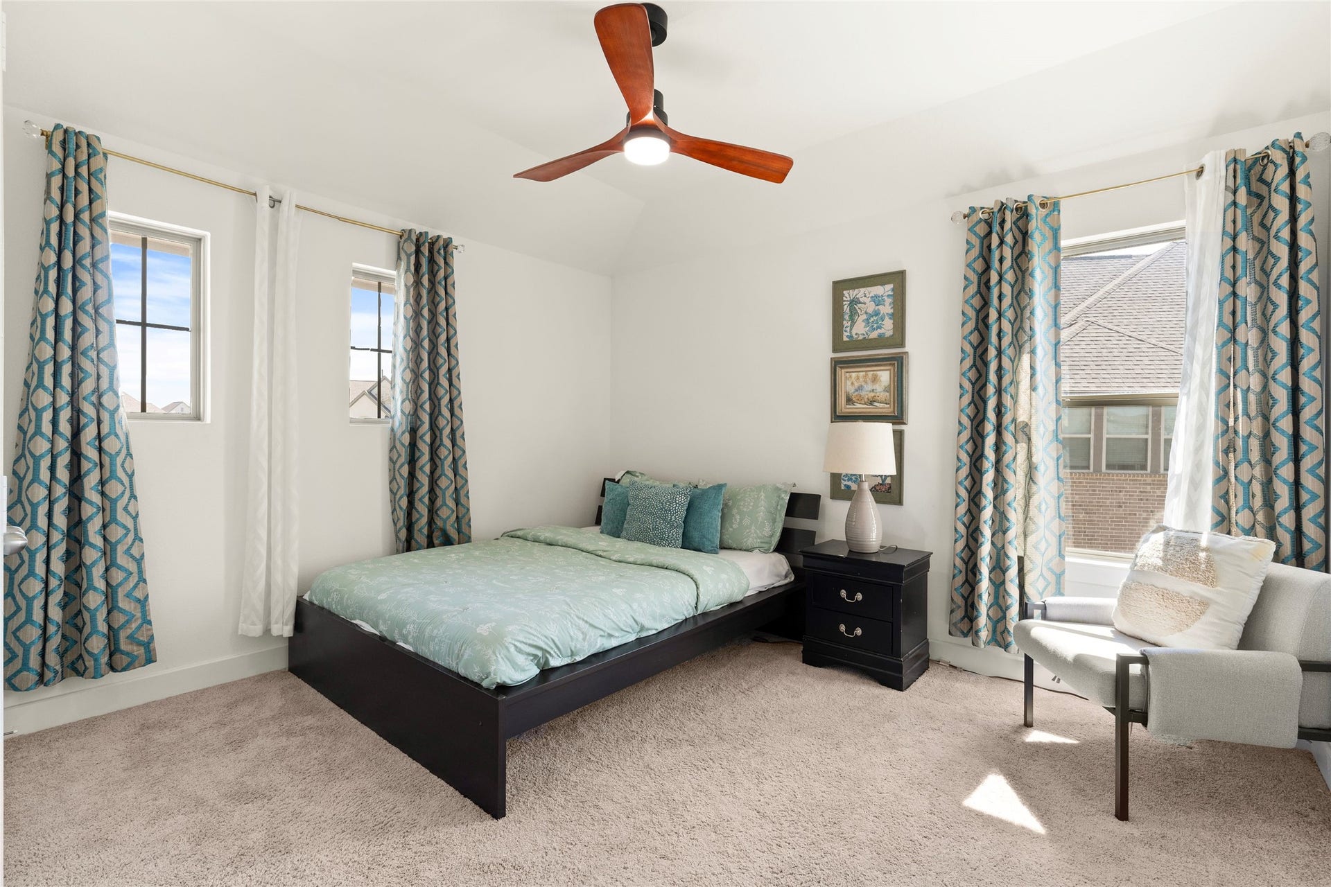 11111 Zinnias Court, Cypress, TX 77433 Natural light, a ceiling fan, and a lovely neutral palette create a welcoming bedroom retreat.