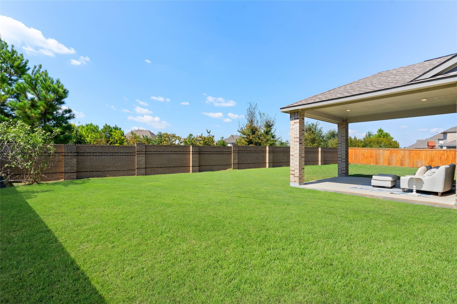 11111 Zinnias Court, Cypress, TX 77433 Look at all that green space! A spacious fenced backyard and covered patio provide endless possibilities for outdoor gatherings and quiet evenings at home.