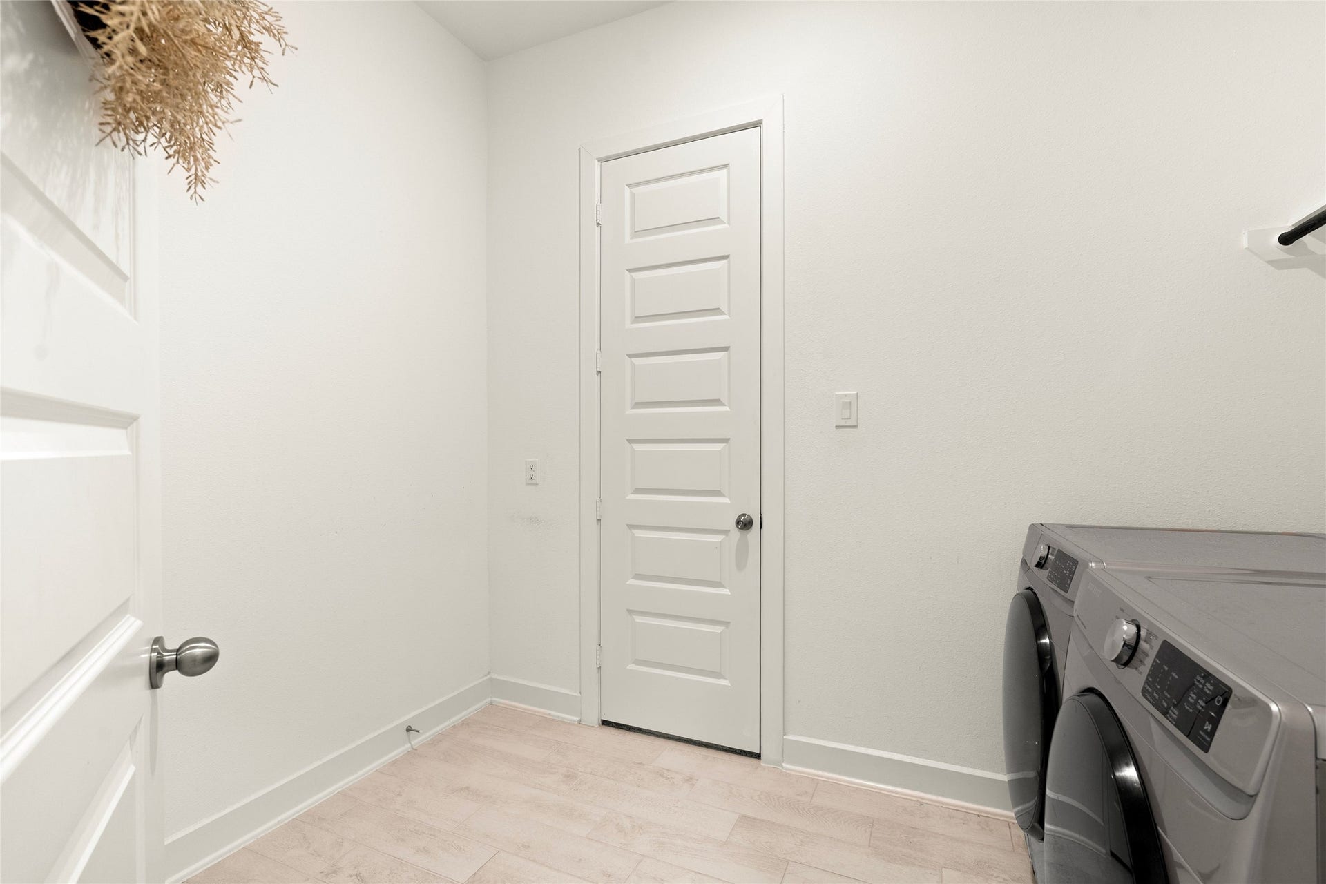 11111 Zinnias Court, Cypress, TX 77433 A dedicated utility room offers practical storage and laundry space, keeping everyday essentials neatly organized.