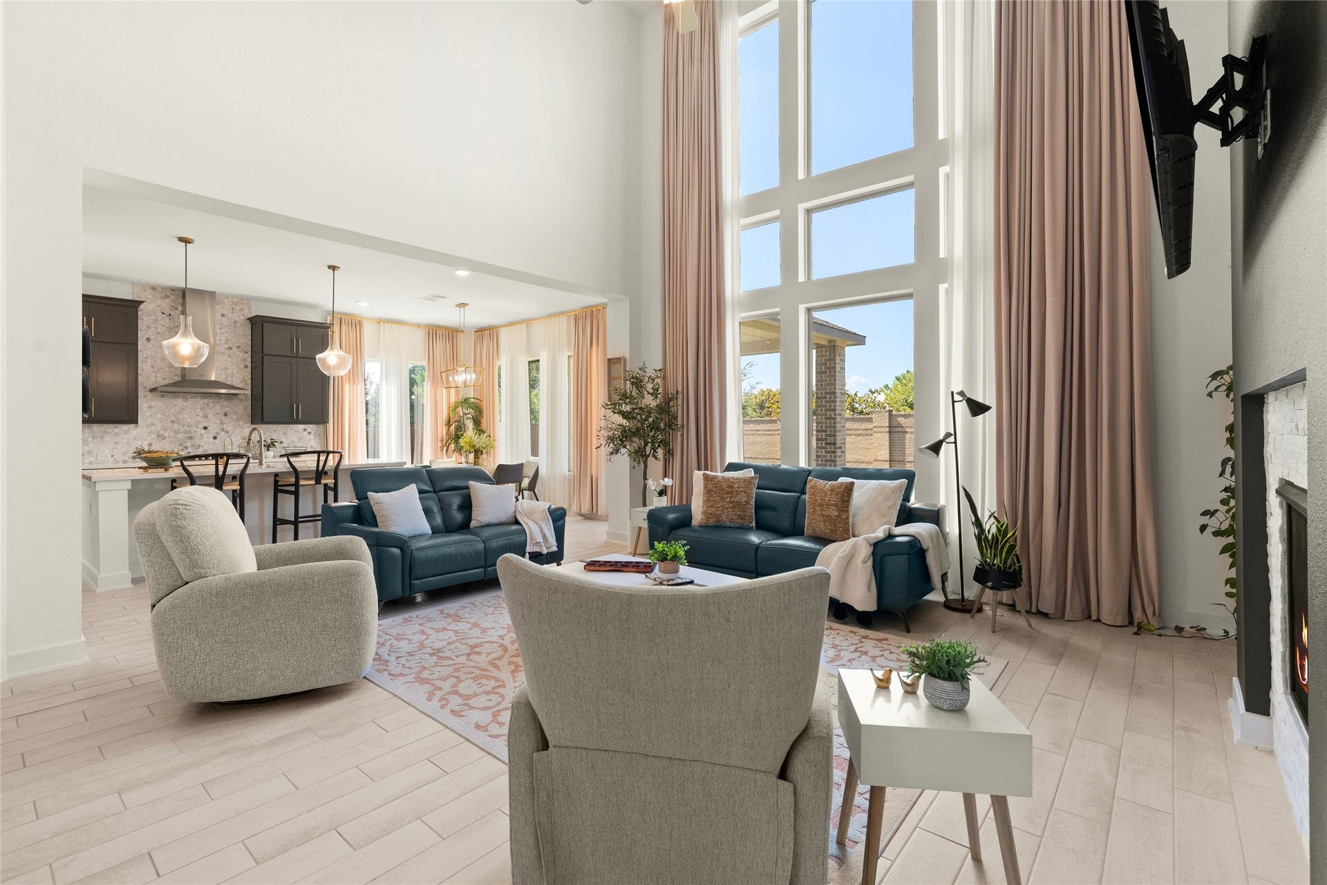 11111 Zinnias Court, Cypress, TX 77433 Imagine gathering around the fireplace beneath those incredible windows! This living room is every bit as impressive as the home's grand entrance.
