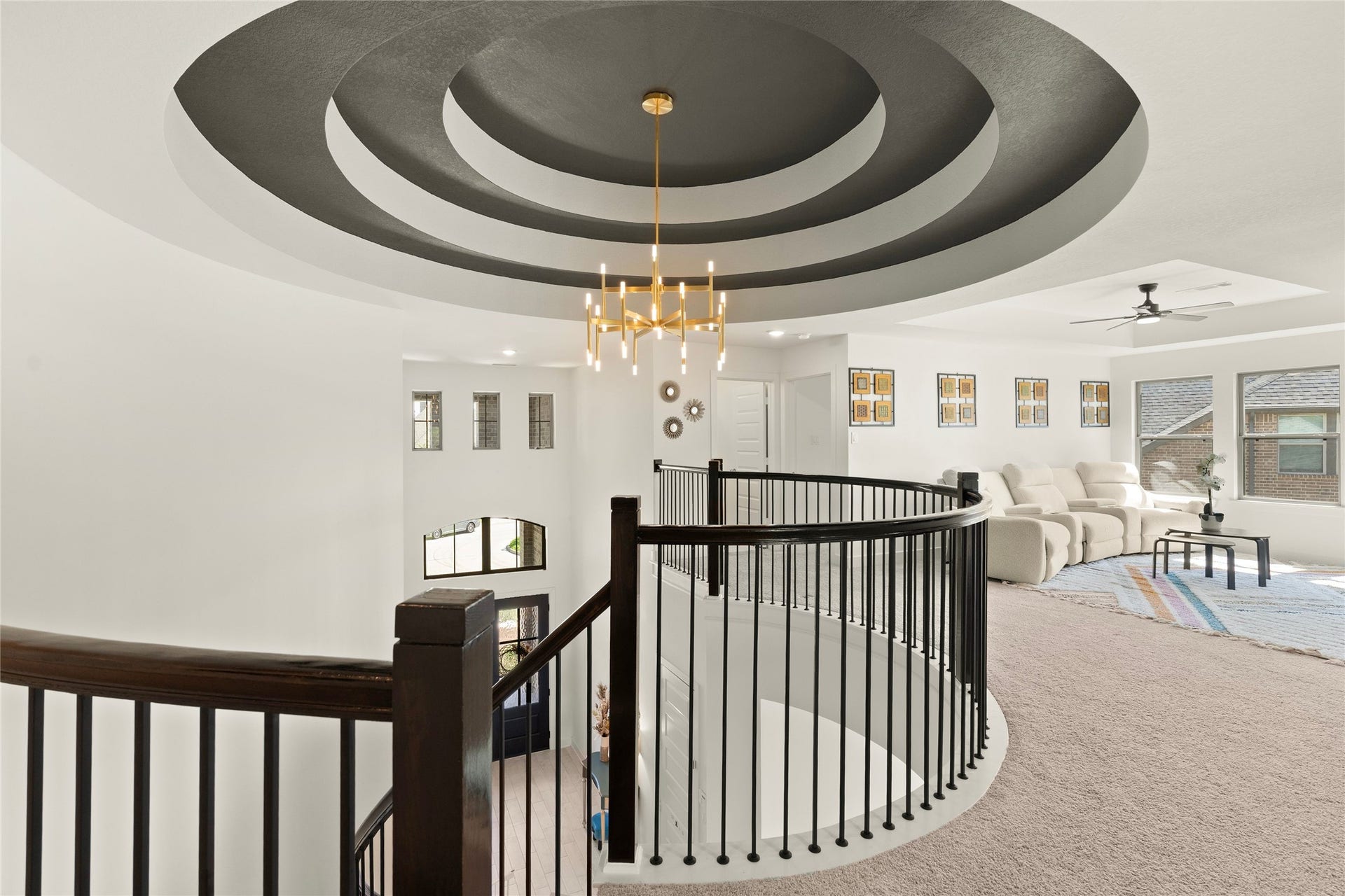 11111 Zinnias Court, Cypress, TX 77433 The curved upstairs balcony offers a breathtaking view of the grand entry and its spectacular circular ceiling design.