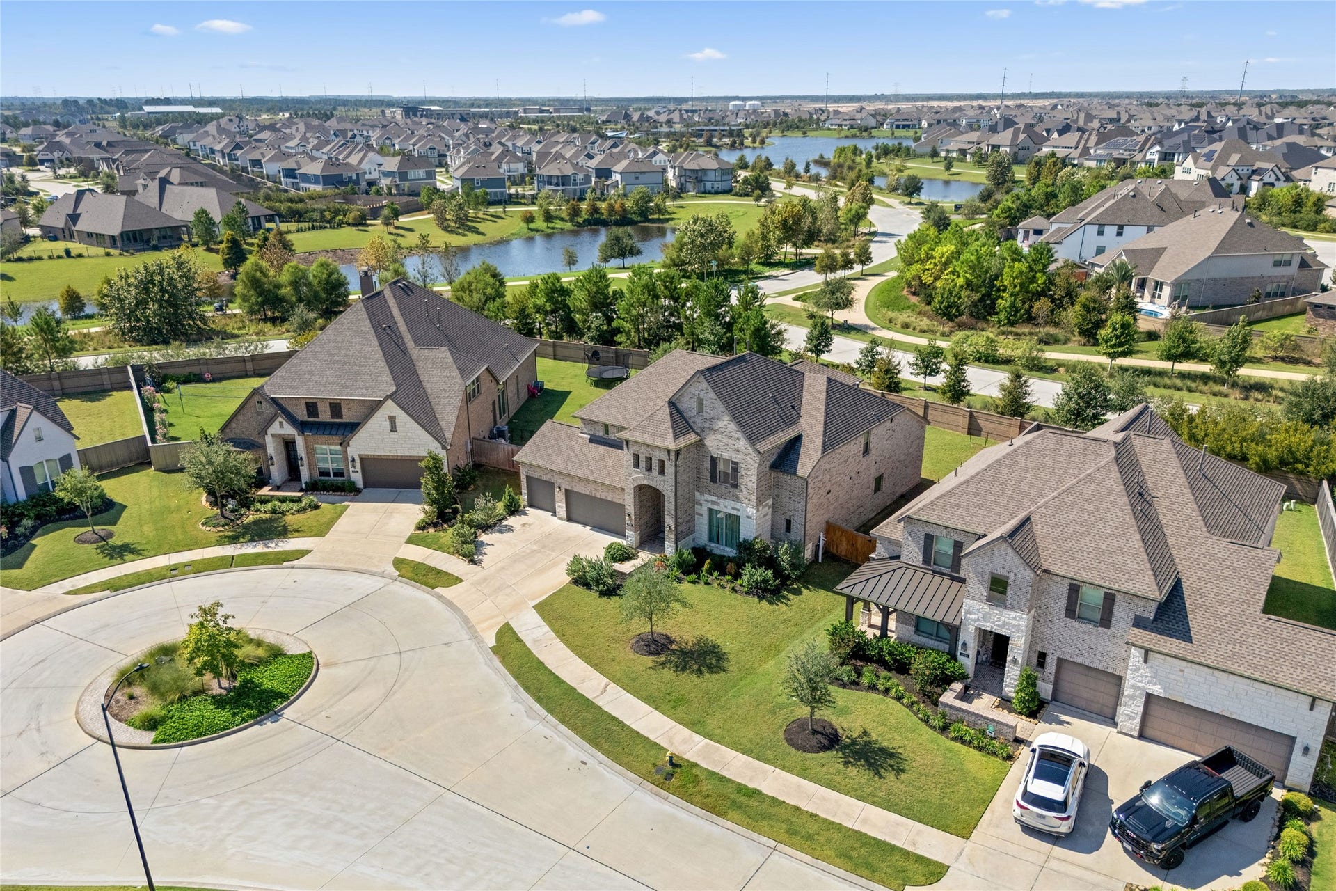 11111 Zinnias Court, Cypress, TX 77433 Beautiful neighborhood scenery, nearby water views, and tree-lined pathways create a wonderful backdrop for this impressive home.