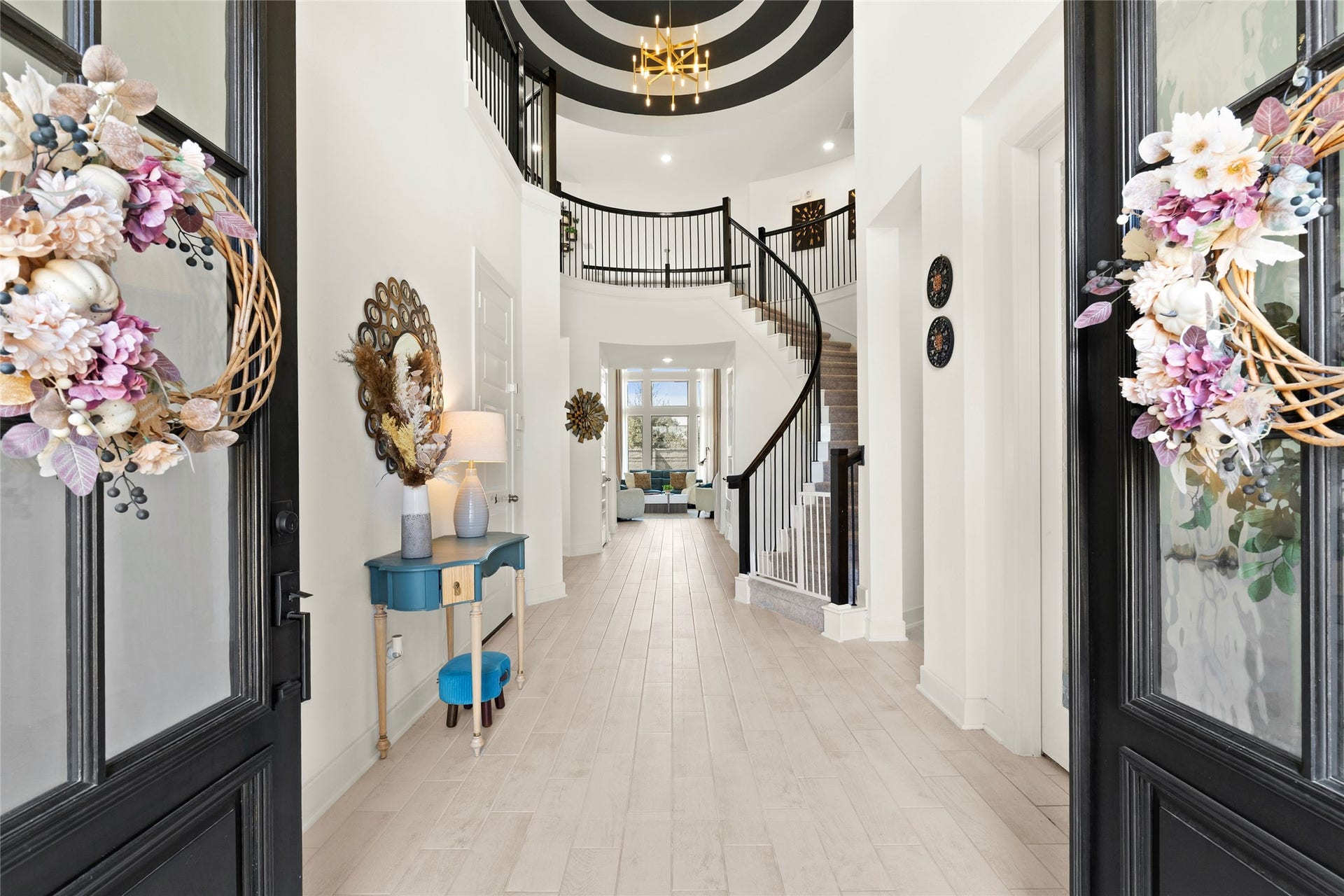 11111 Zinnias Court, Cypress, TX 77433 Welcome to a home that knows how to make an entrance! Soaring ceilings, a sweeping curved staircase, elegant chandelier, and dramatic architectural details create an unforgettable first impression.