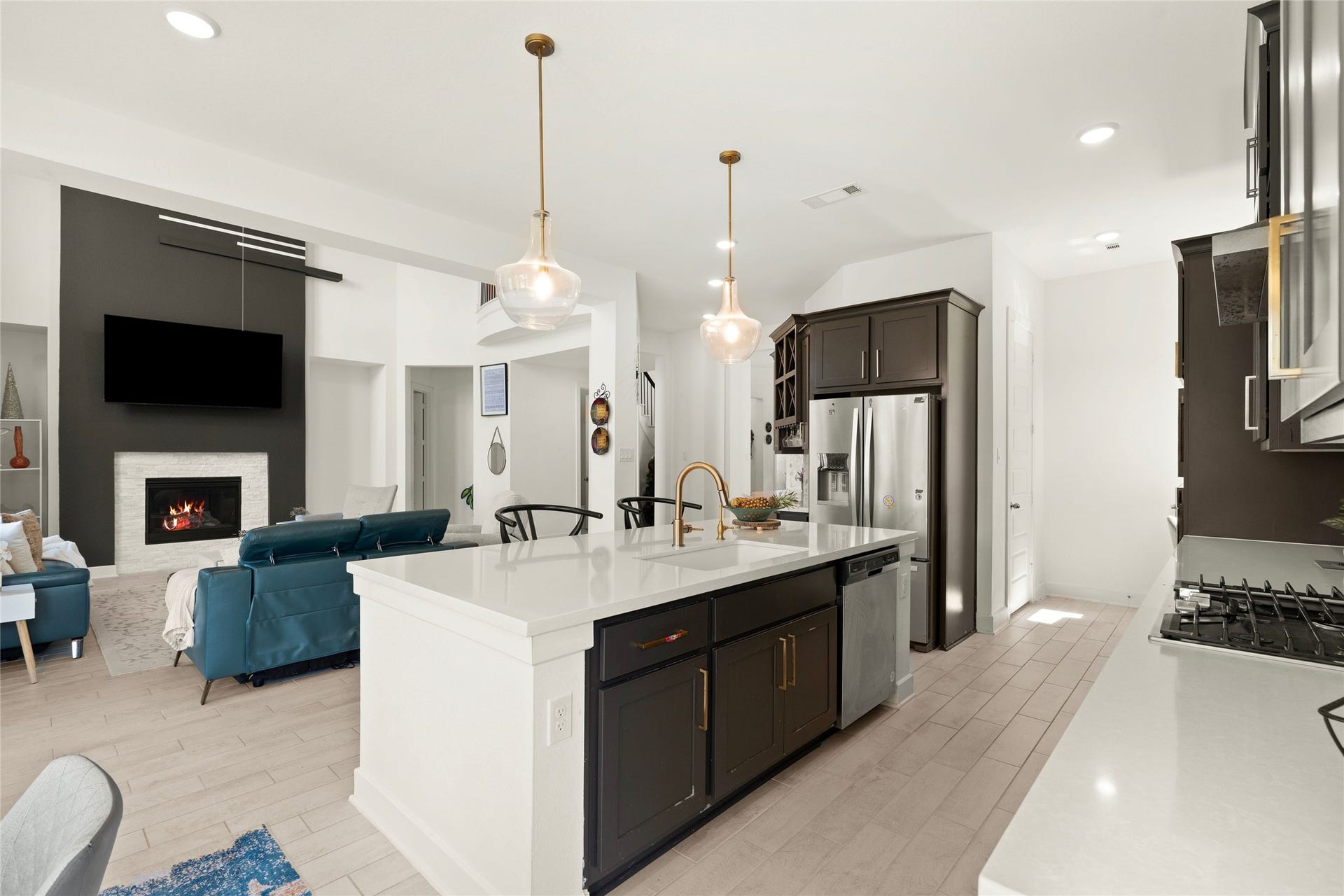 11111 Zinnias Court, Cypress, TX 77433 The open kitchen overlooks the living area, allowing conversation and company to flow effortlessly from one beautiful space to another.
