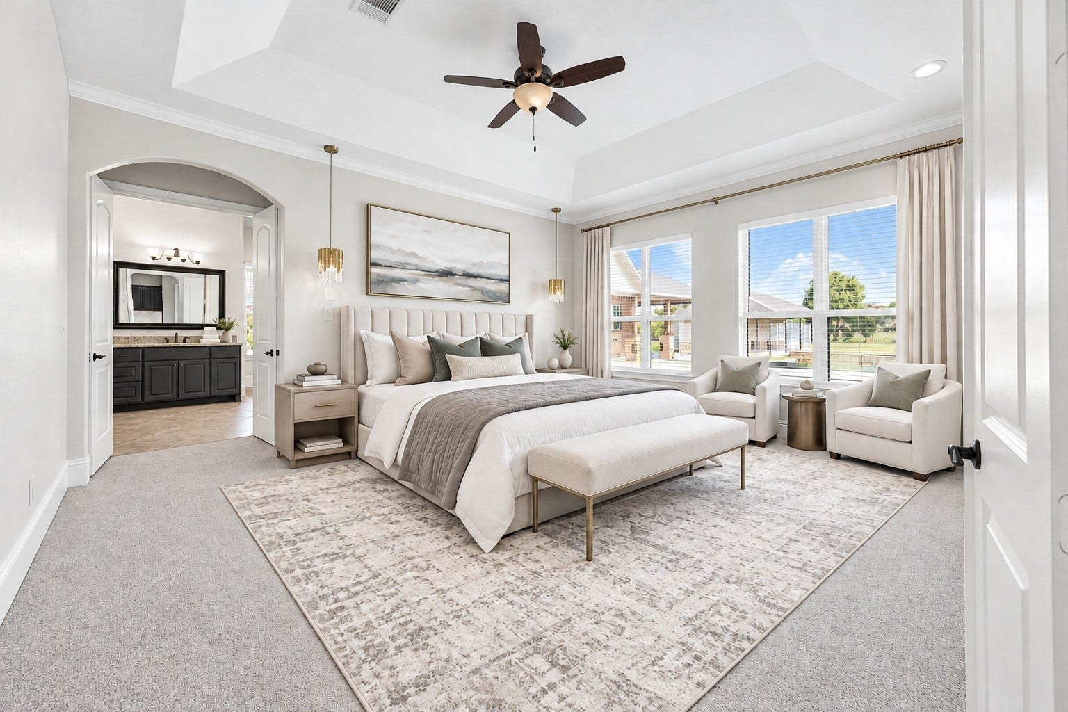 5127 Beekman Drive, Missouri City, TX 77459 The primary retreat is framed by a dramatic tray ceiling and oversized windows overlooking the private grounds, offering direct access to the spa-inspired ensuite. Virtually staged.